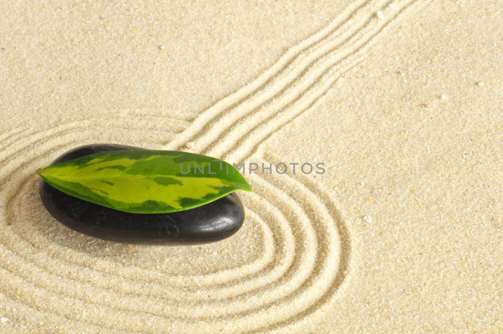 zen stone spa or wellness concept with sand