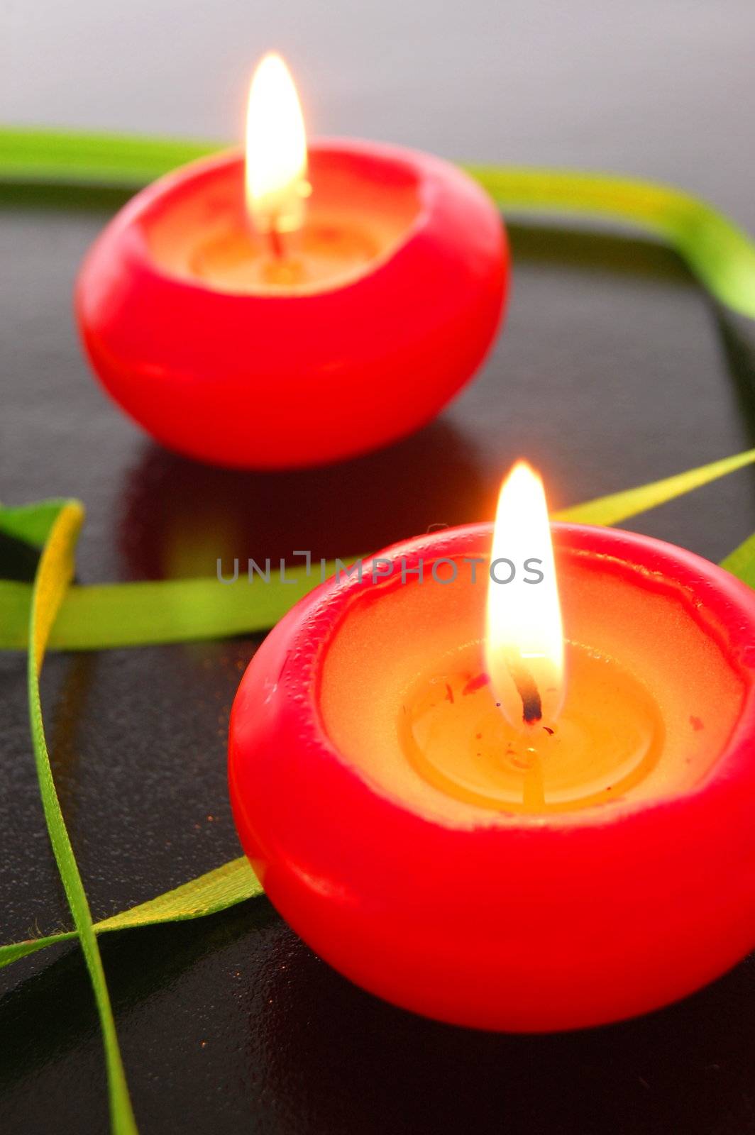 red candles with warm light showing love or romance concept     
