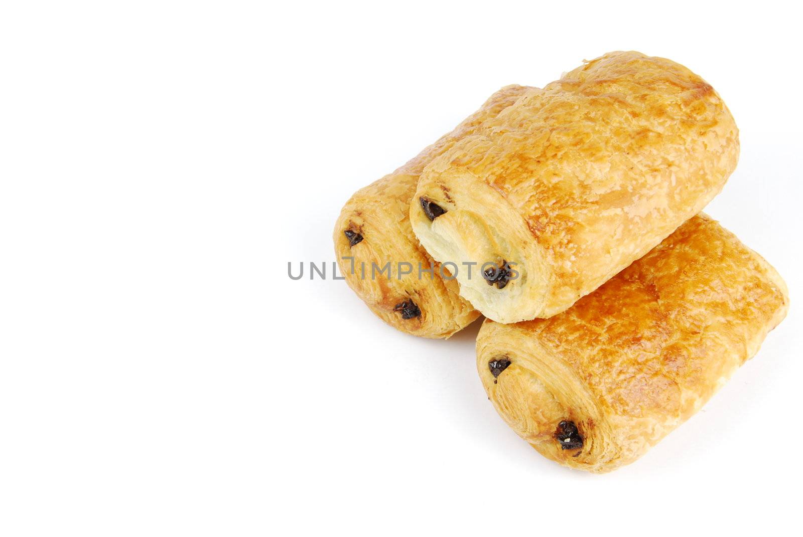 three fresh pain au chocolat isolated on white background