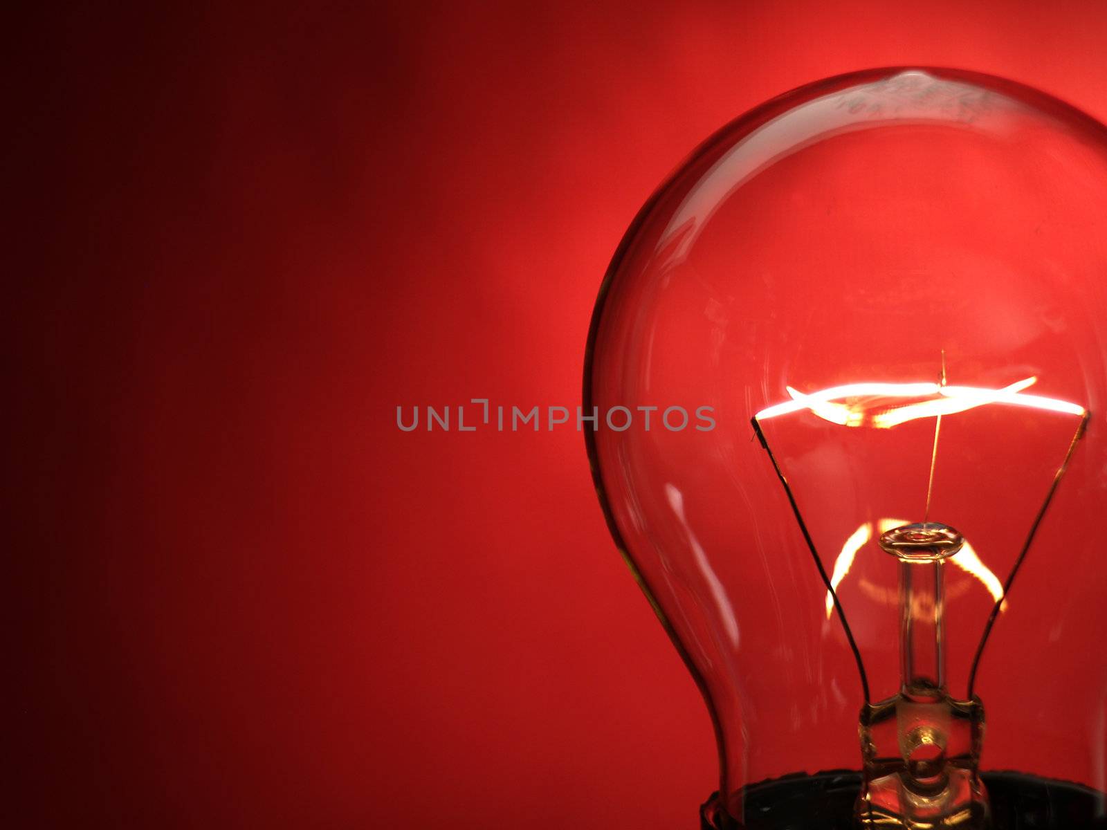 A bulb light on red background   