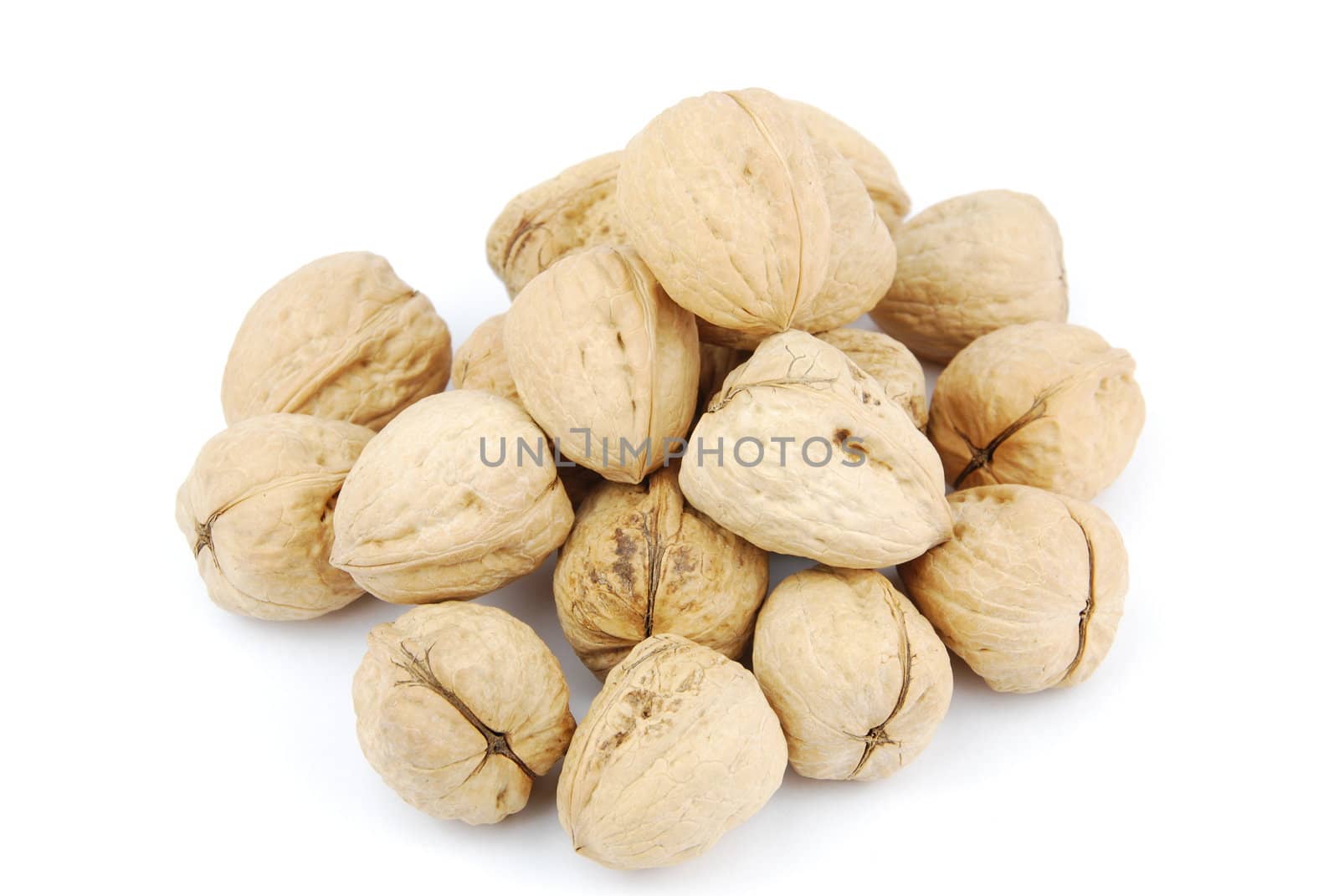 pile of walnuts isolated on white background
