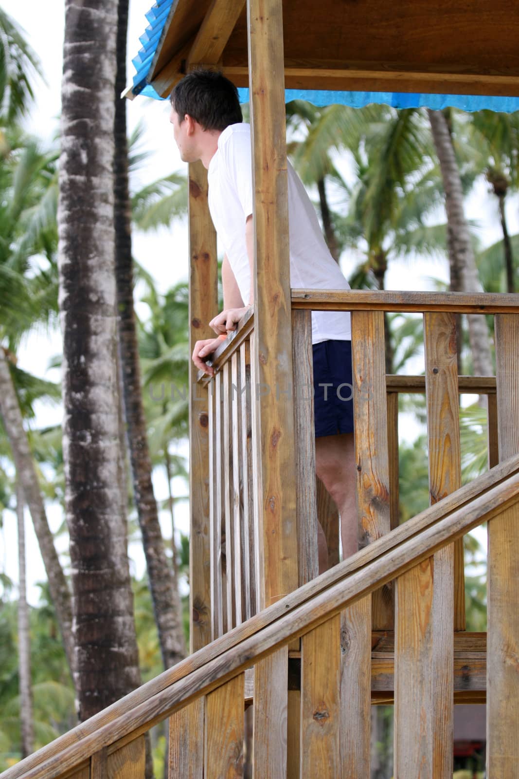 man looking after order on the beach