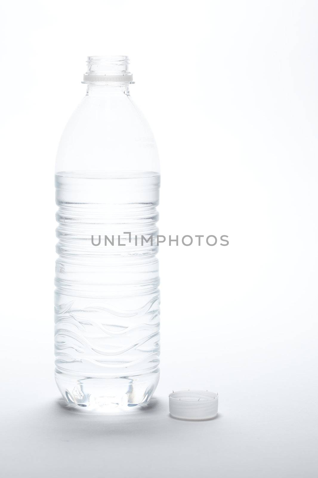 Water Bottle and Cap Image on A Gradated White Background.