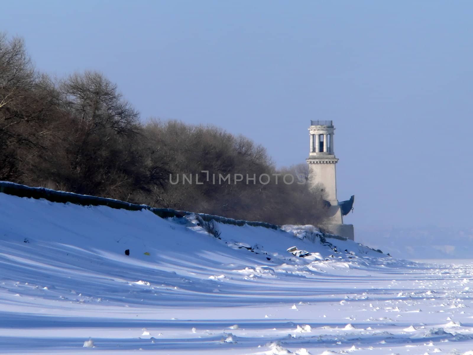 Lighthouse on winters sea