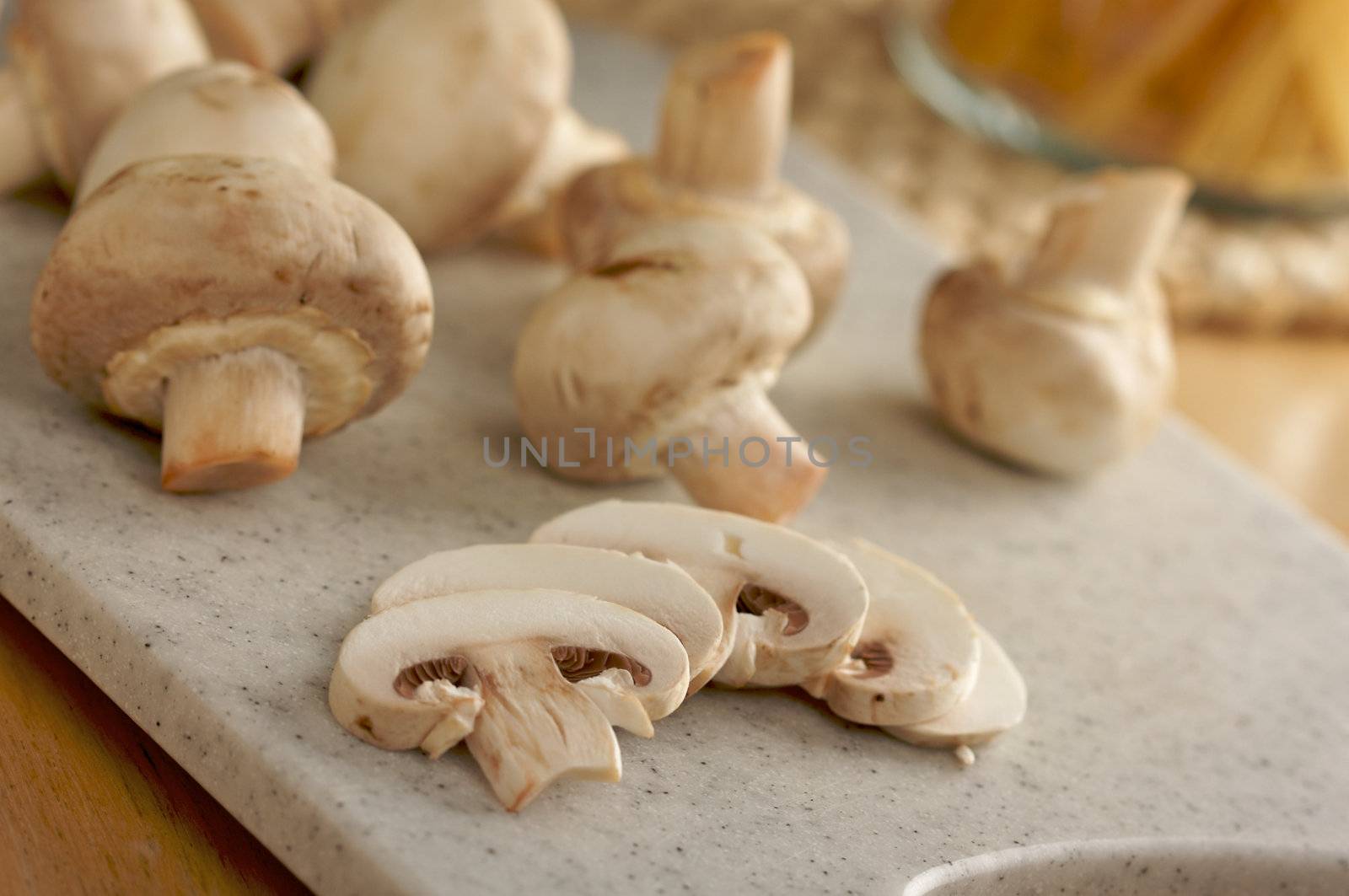 Mushrooms on a Cutting Board by Feverpitched