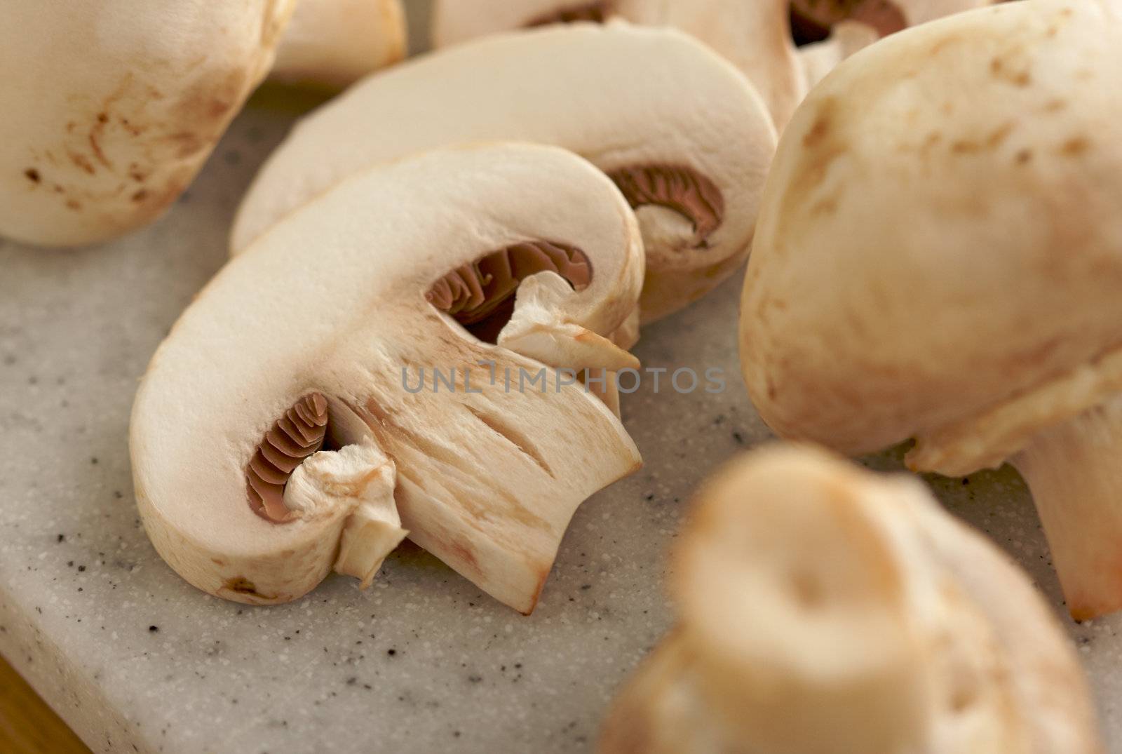 Mushrooms on a Cutting Board by Feverpitched