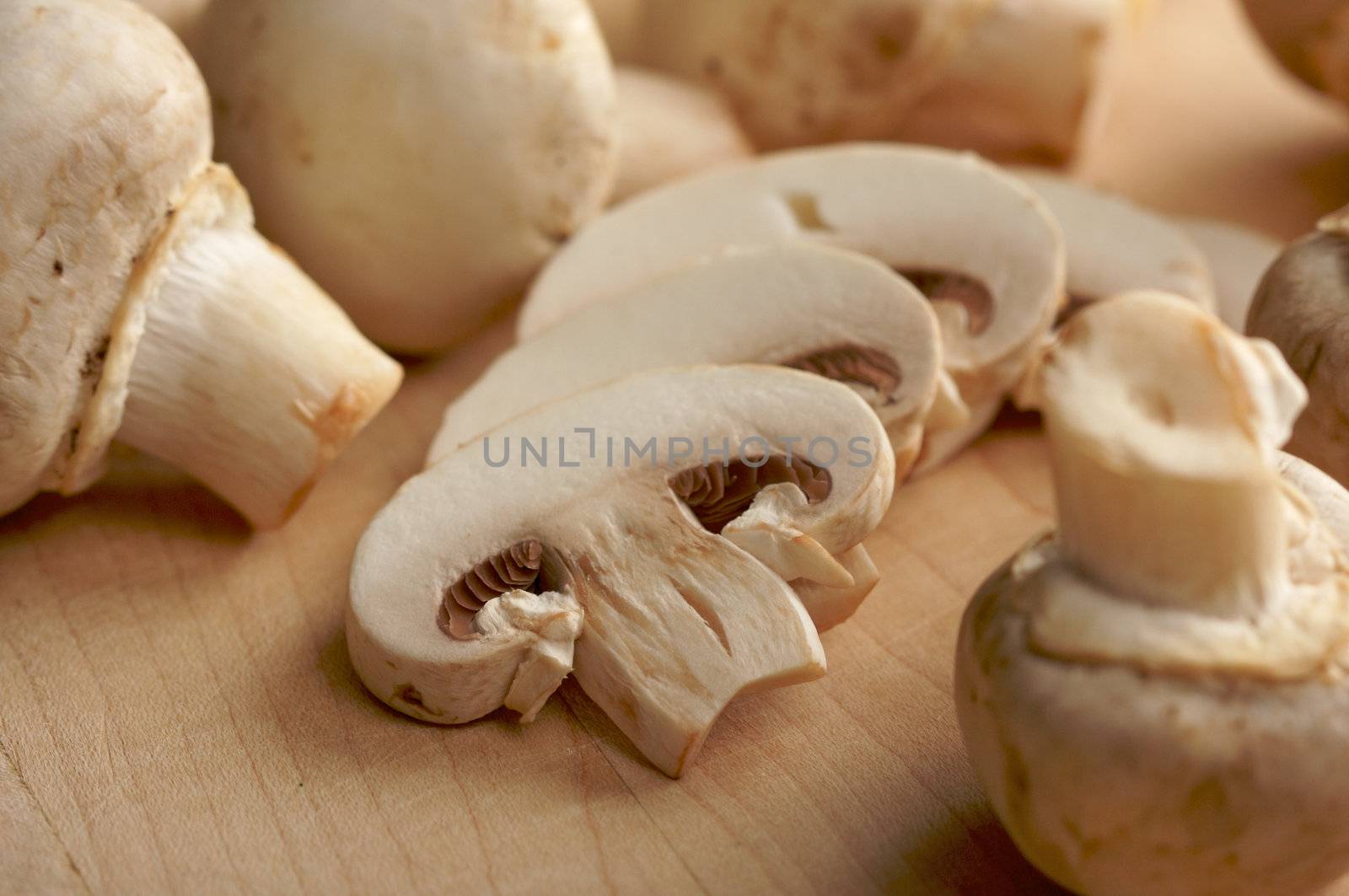 Mushrooms on a Cutting Board by Feverpitched