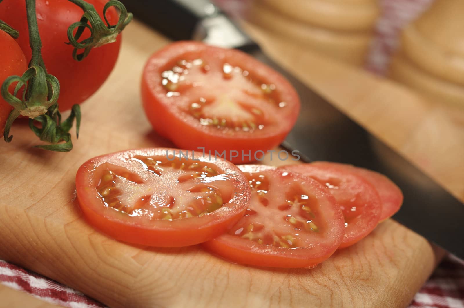 Fresh Cut Tomato on a Cutting Board