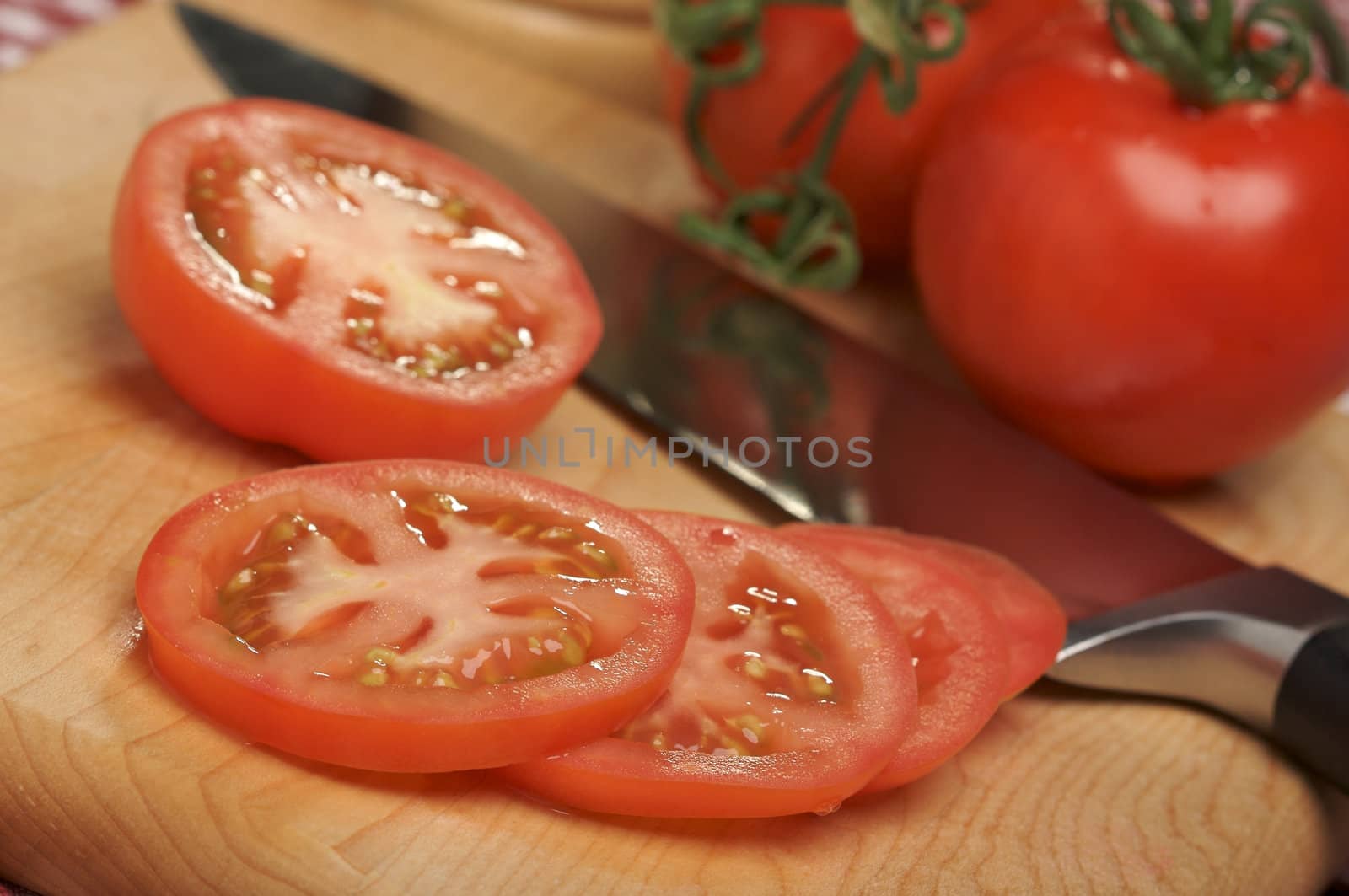 Fresh Cut Tomato on a Cutting Board