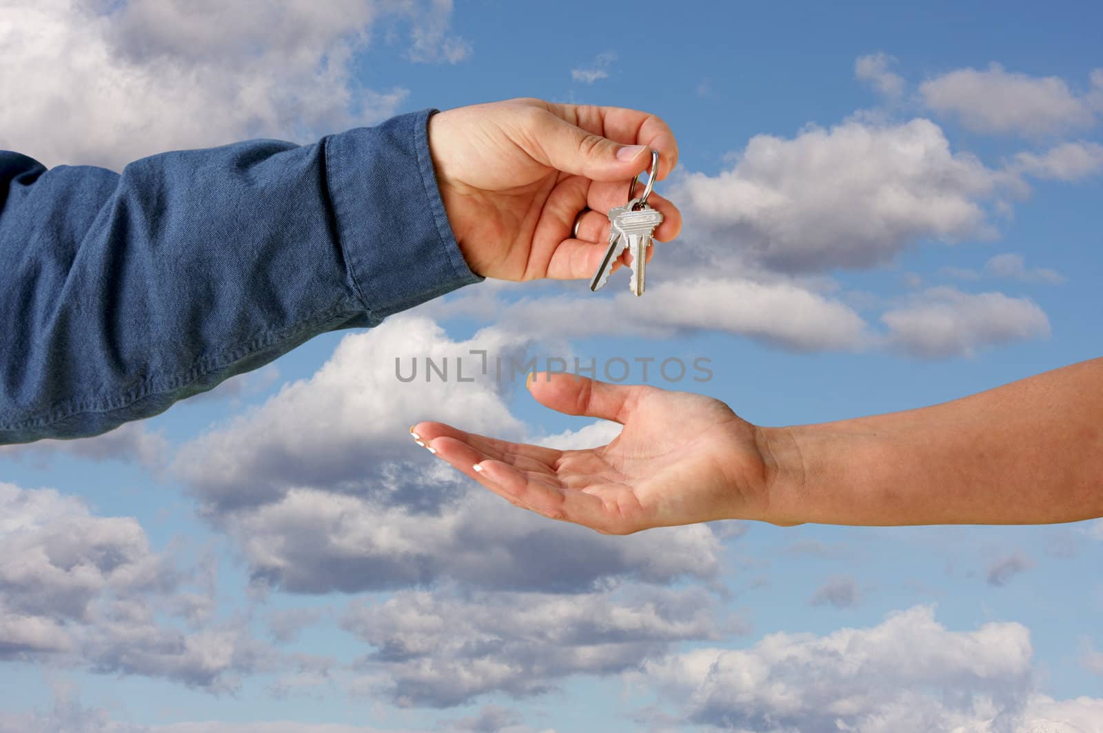 Handing Overe the Keys over a Beautiful Sky.