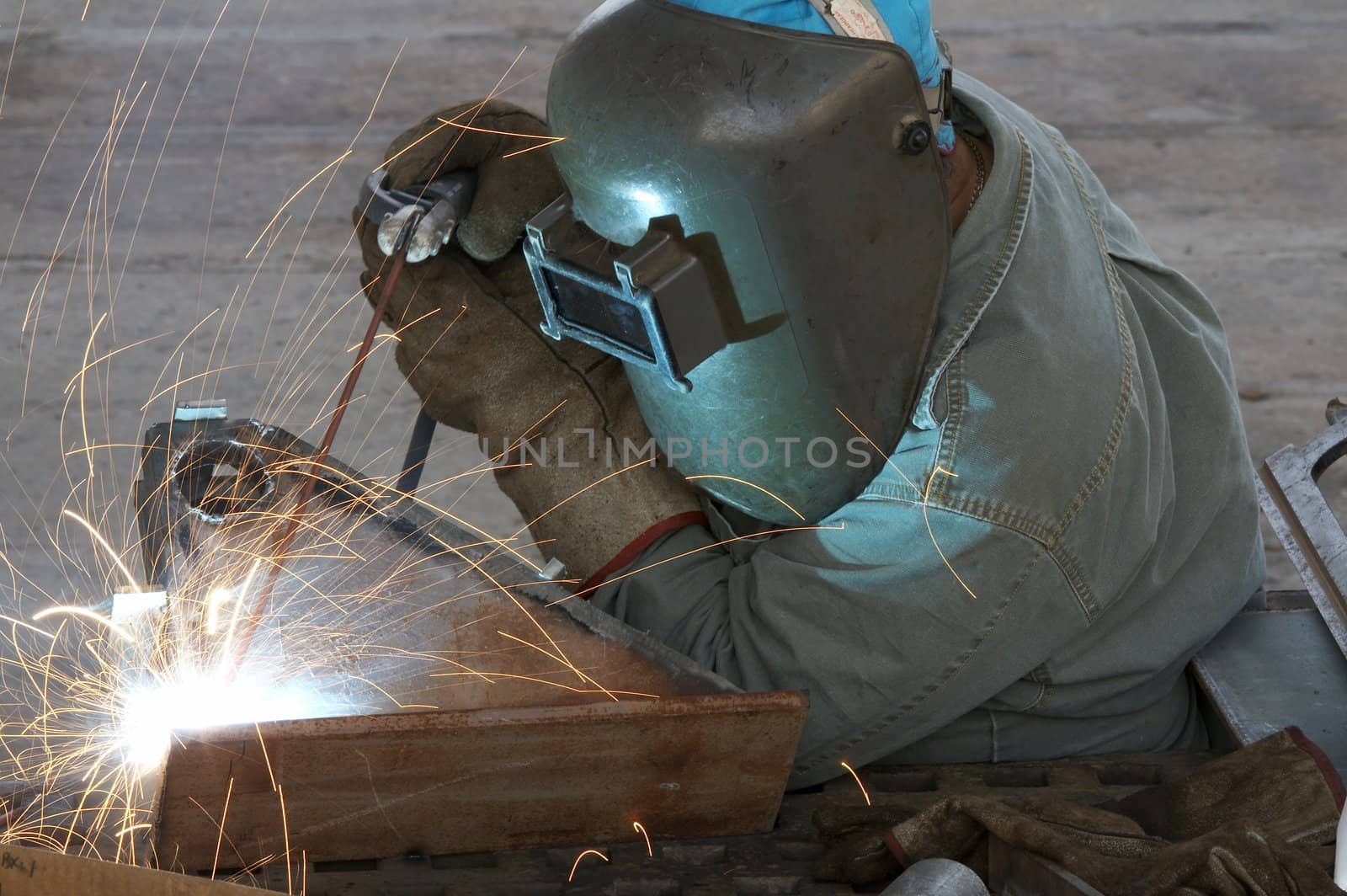 a welder working at shipyard during day shift