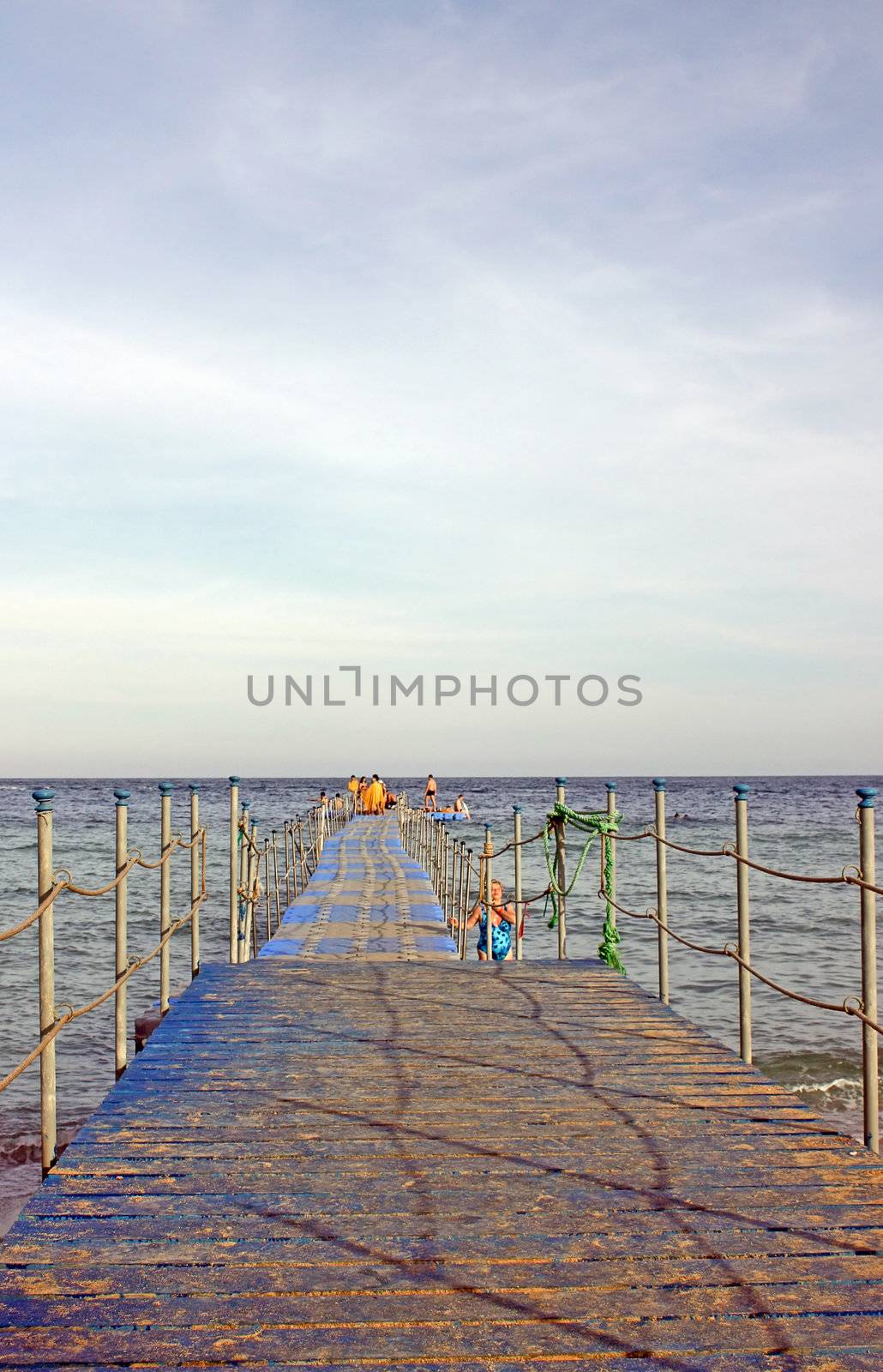 Egypt, Sharm-el-Sheikh, Red Sea. People swim with a pontoon on the beach.