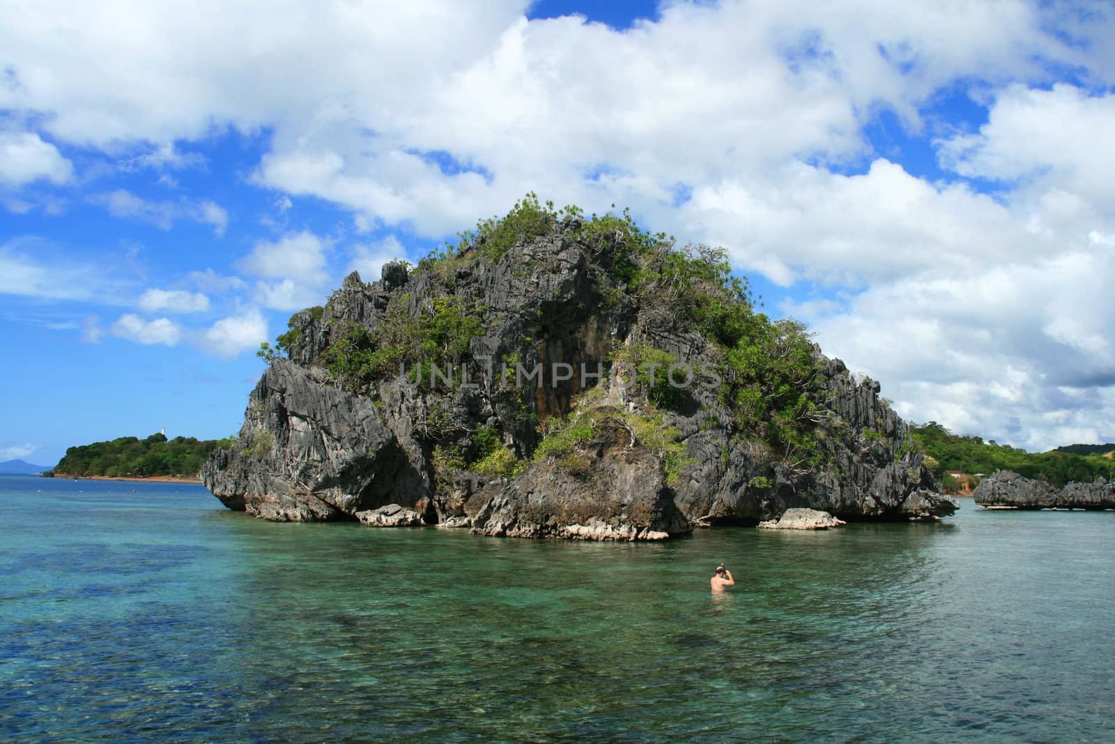 scenic view of a tropical island in a lagoon