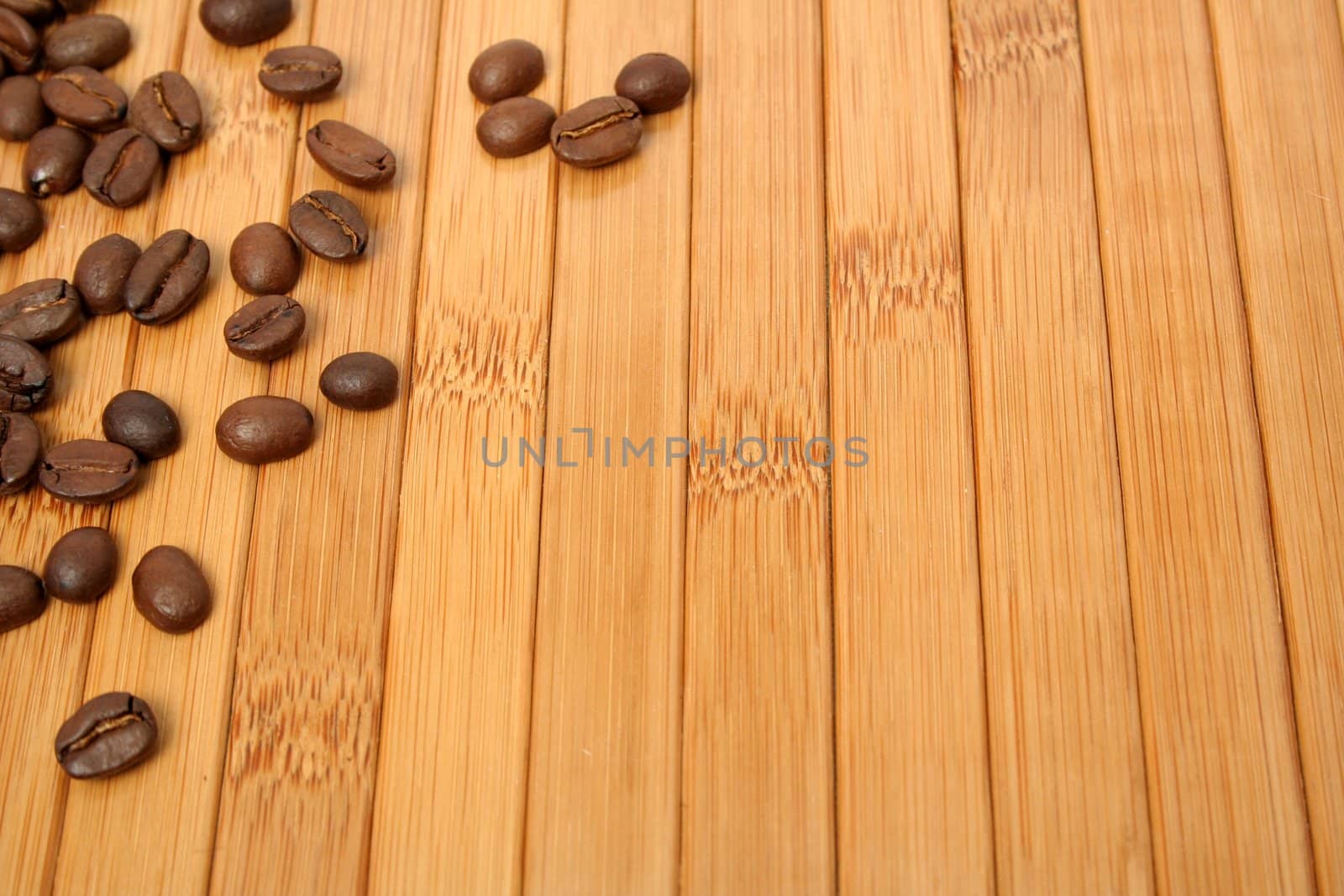 Grains of coffee on a carpet made of a bamboo 6