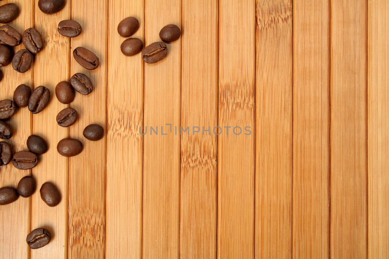 Grains of coffee on a carpet made of a bamboo 7