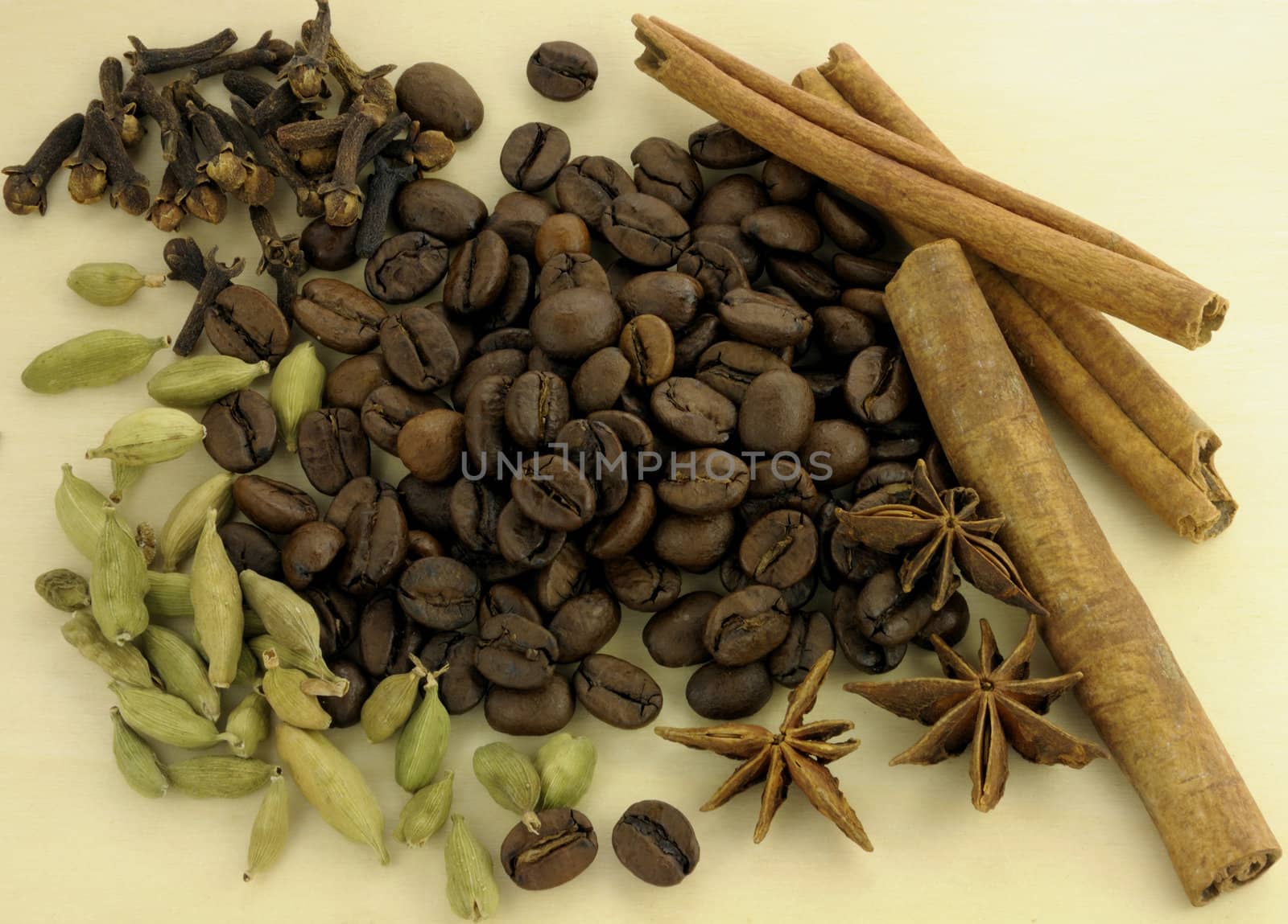 Coffee and spices on a wooden background
