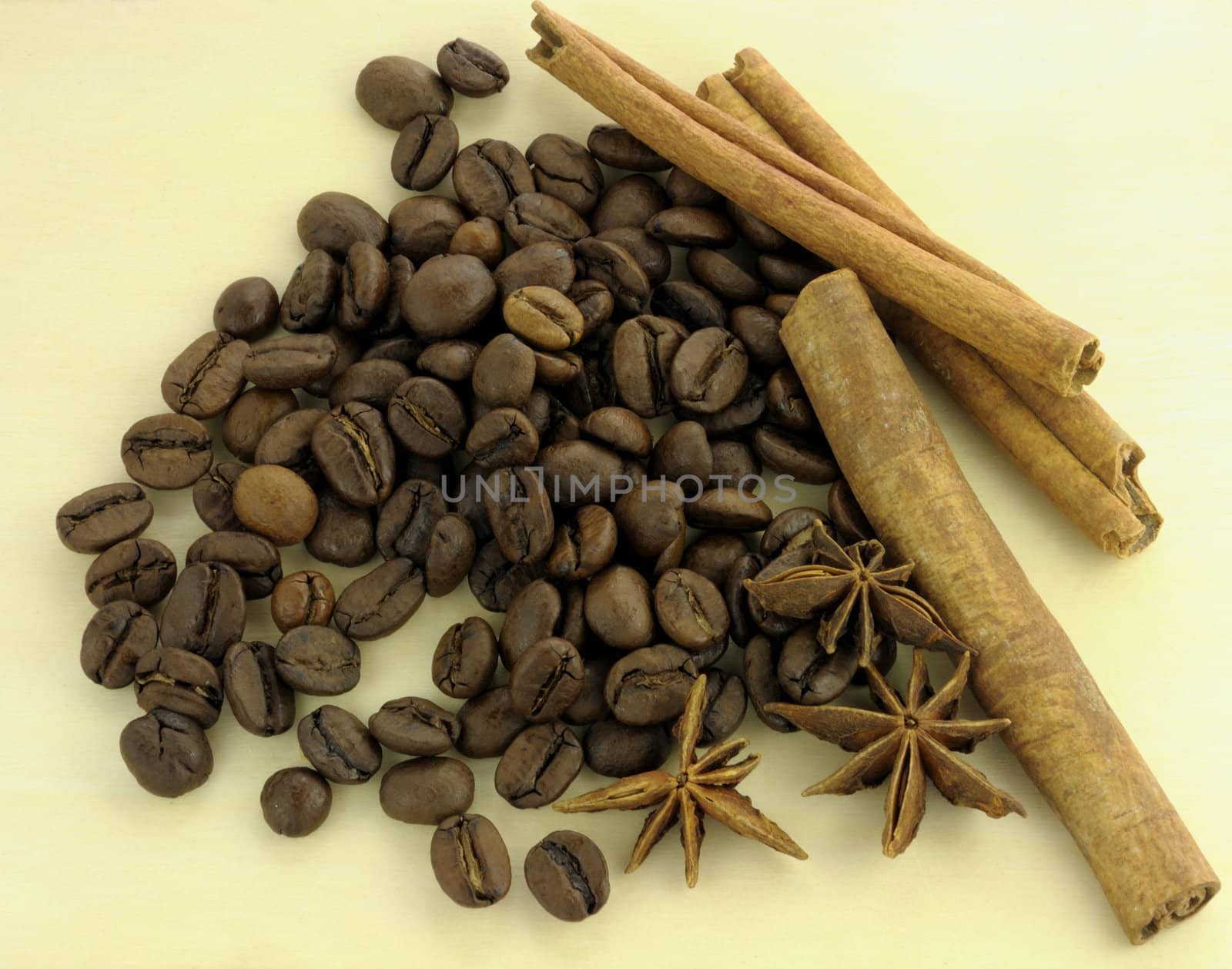 Coffee and spices on a wooden background