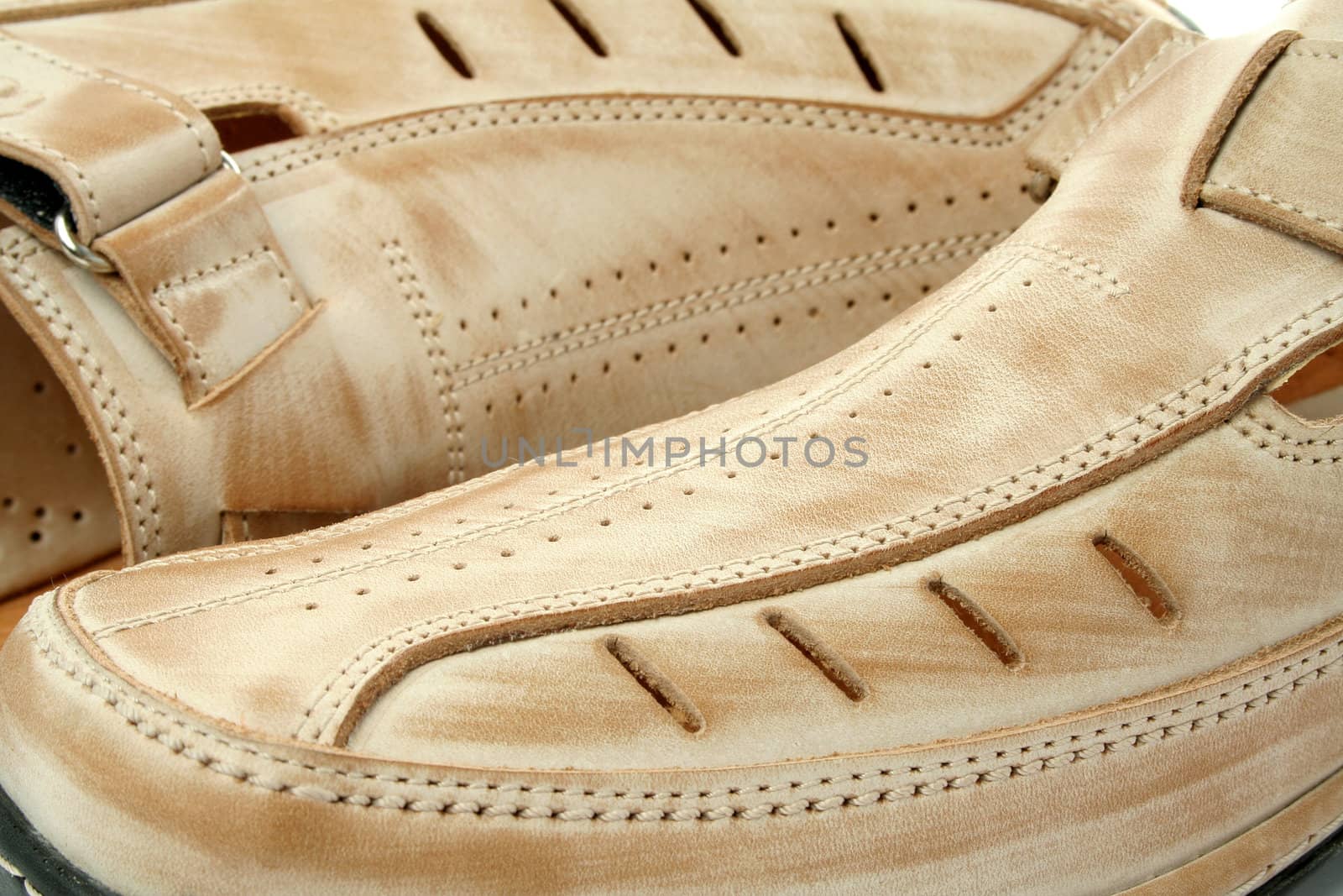 Two man's leather shoes of brown color, (look similar images in my portfolio)