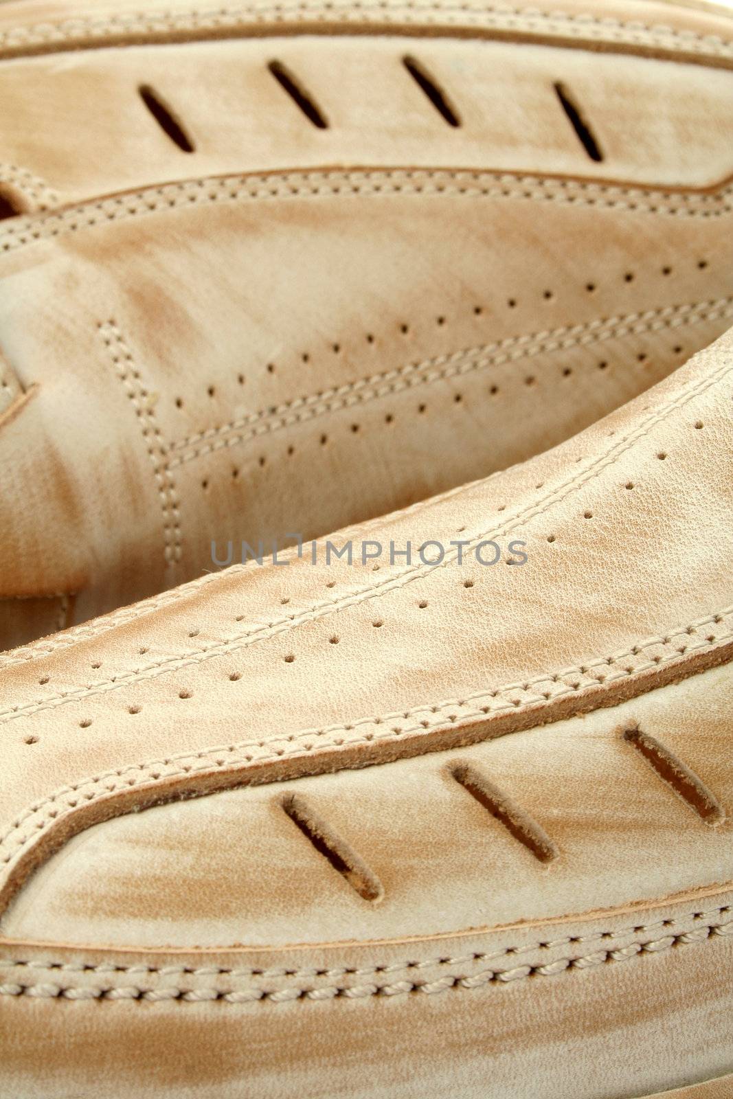 Two man's leather shoes of brown color, (look similar images in my portfolio)