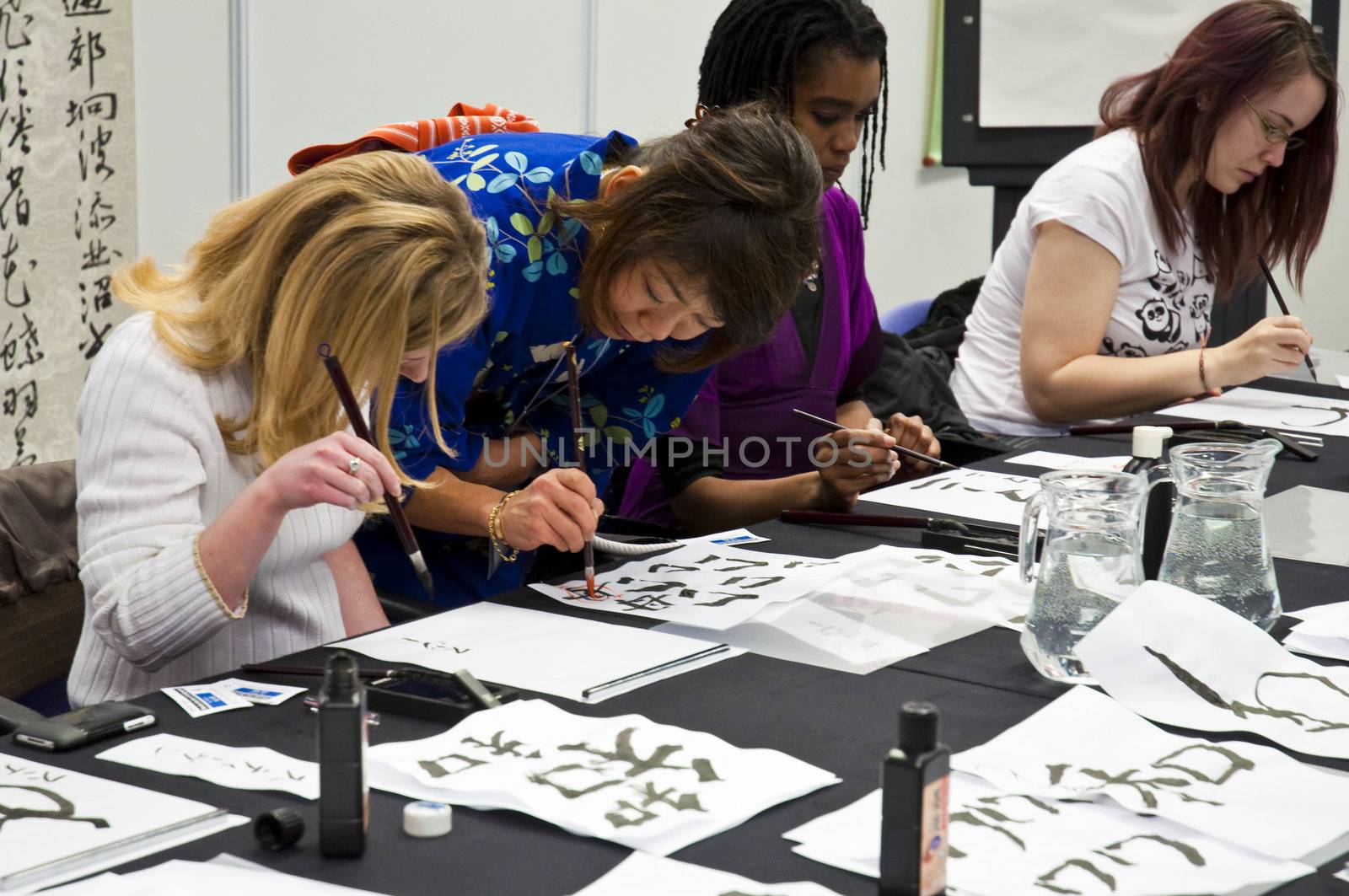 LONDON - JANUARY 30: Visitors in Shodo workshop during the Tokyo Day.  January 30, 2010 in London, England.