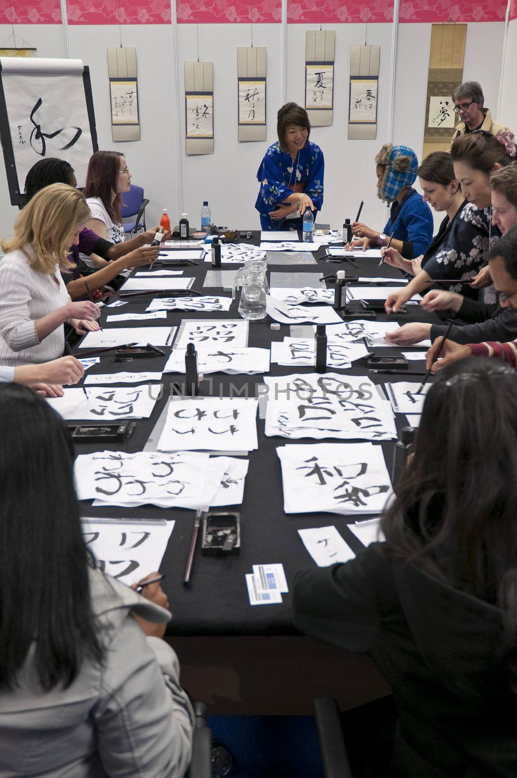 LONDON - JANUARY 30: Visitors in Shodo workshop during the Tokyo Day.  January 30, 2010 in London, England.