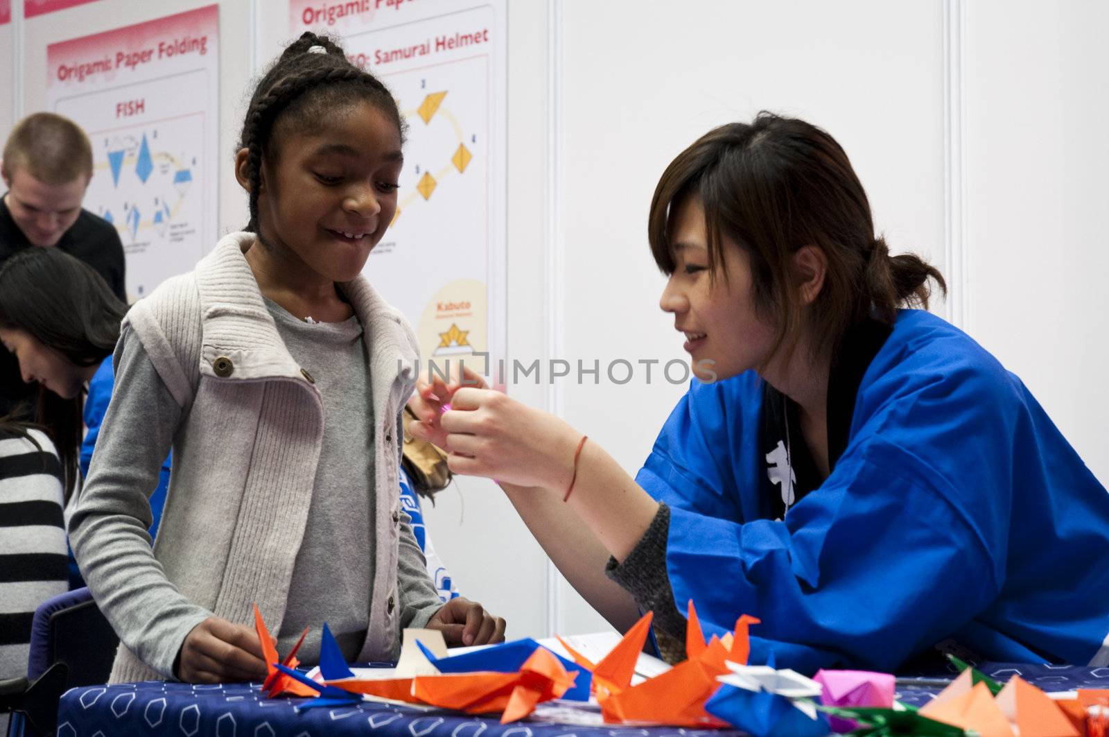 LONDON - JANUARY 30: Visitors in Origami workshop during the Tokyo Day.  January 30, 2010 in London, England.