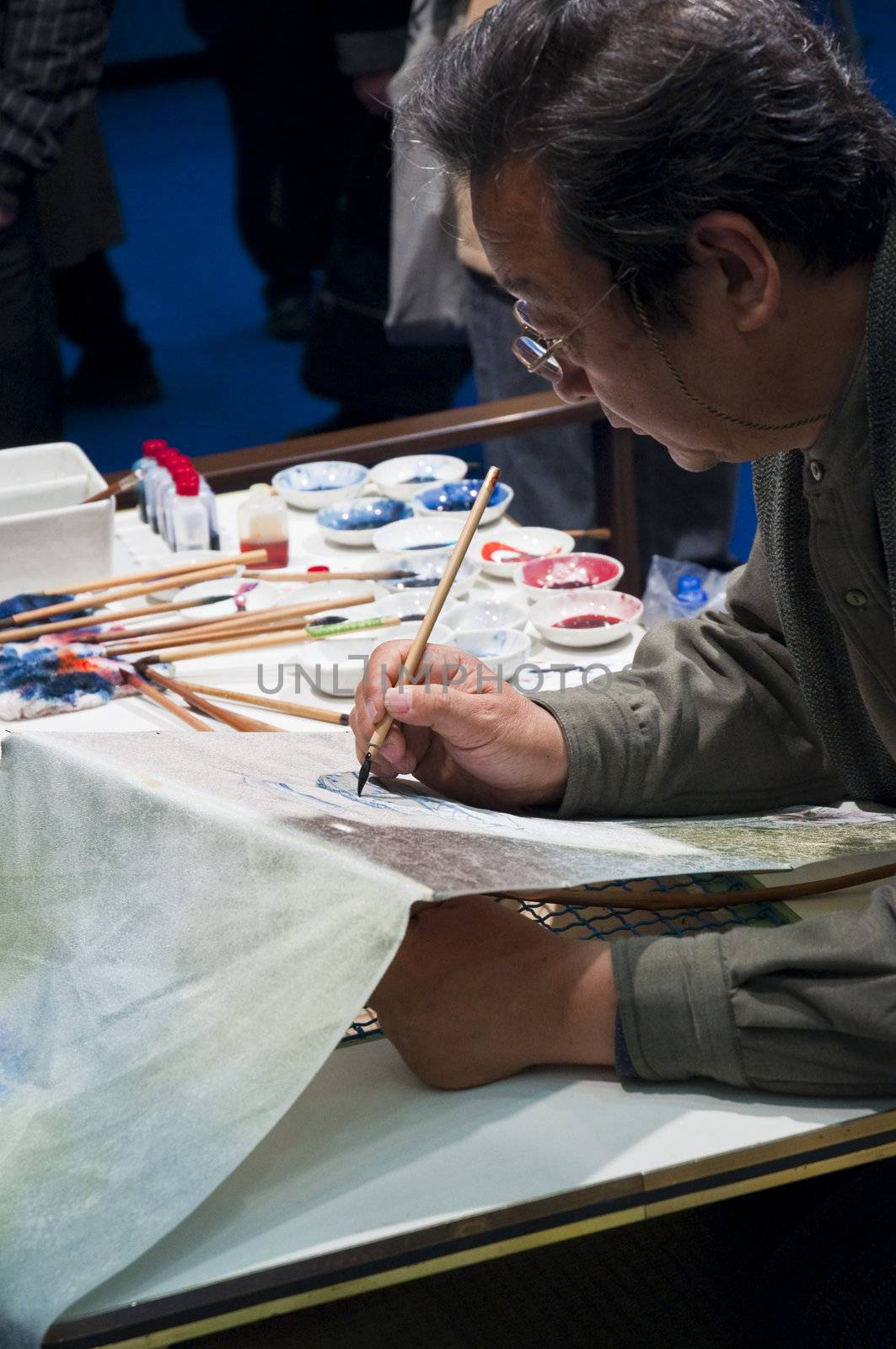 LONDON - JANUARY 30: Demonstration of silk hand-painting during the Tokyo Day.  January 30, 2010 in London, England.