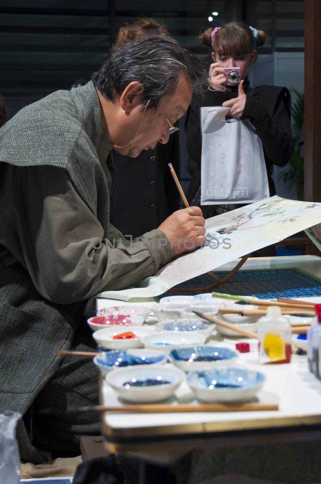 LONDON - JANUARY 30: Demonstration of silk hand-painting during the Tokyo Day.  January 30, 2010 in London, England.