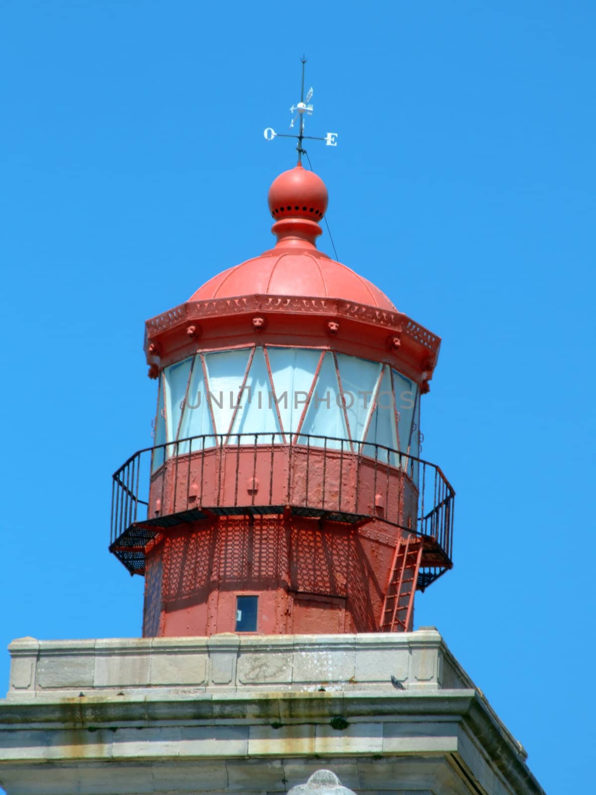 Lighthouse at Cabo Da Roca, also called Focinho Da Roca (Roca Snout), in the most western point of continental Europe. It lies on the Atlantic coast of Lisboa district, about 40 km distant from Lisbon. Known to the Romans as Promontorium Magnum, the cape is a narrow granite cliff, forming the western end of the Sintra Mountains.