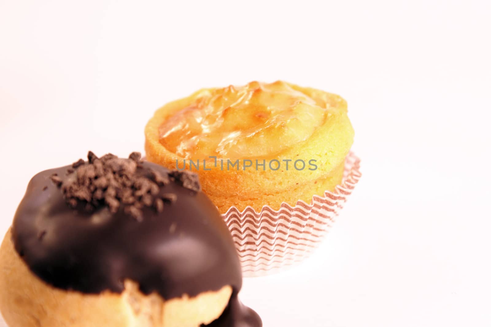 Close-up of some mixed delicious tea cakes isolated on white