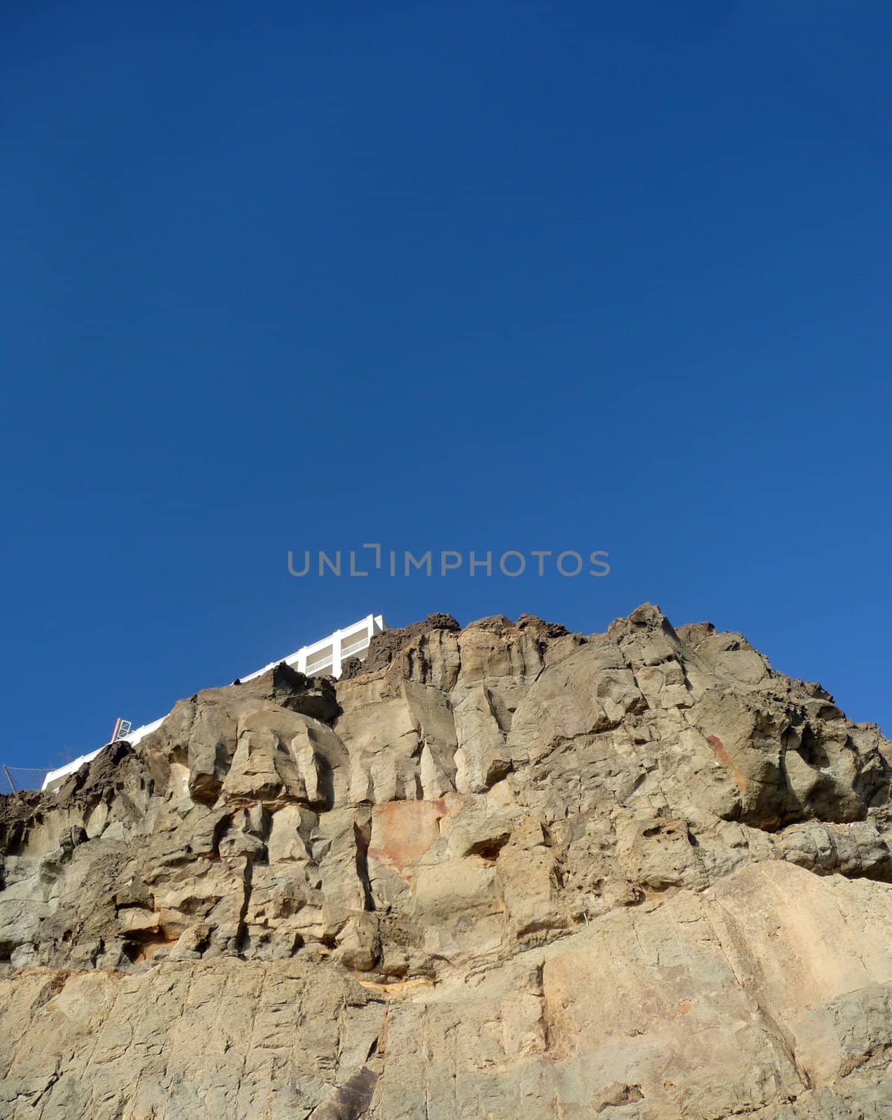 A view of some rocky cliffs with a sky background