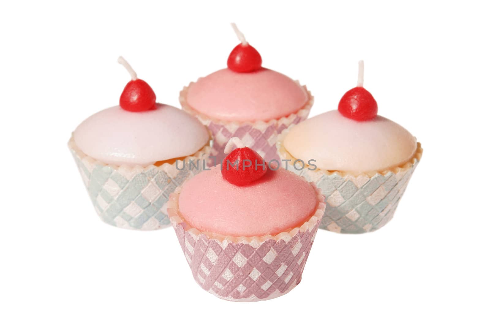 Cupcake shaped candles isolated on white