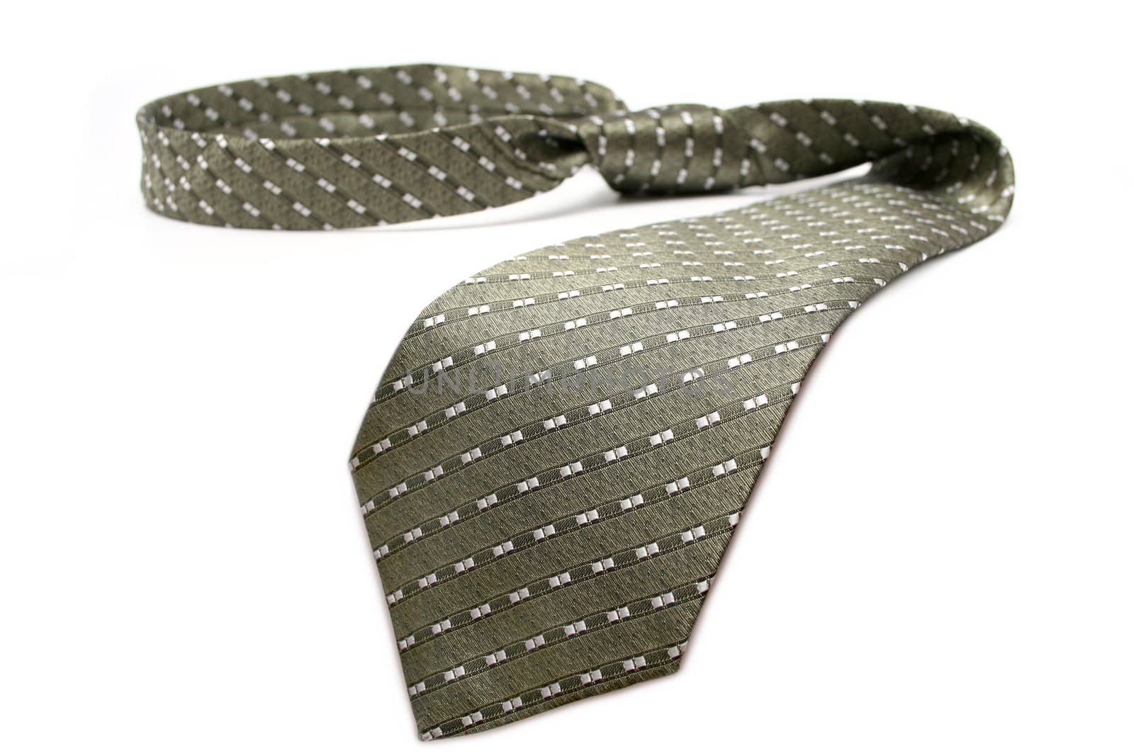 Tie of the businessman of grey color with a simple pattern, isolated on white, (look similar images in my portfolio)