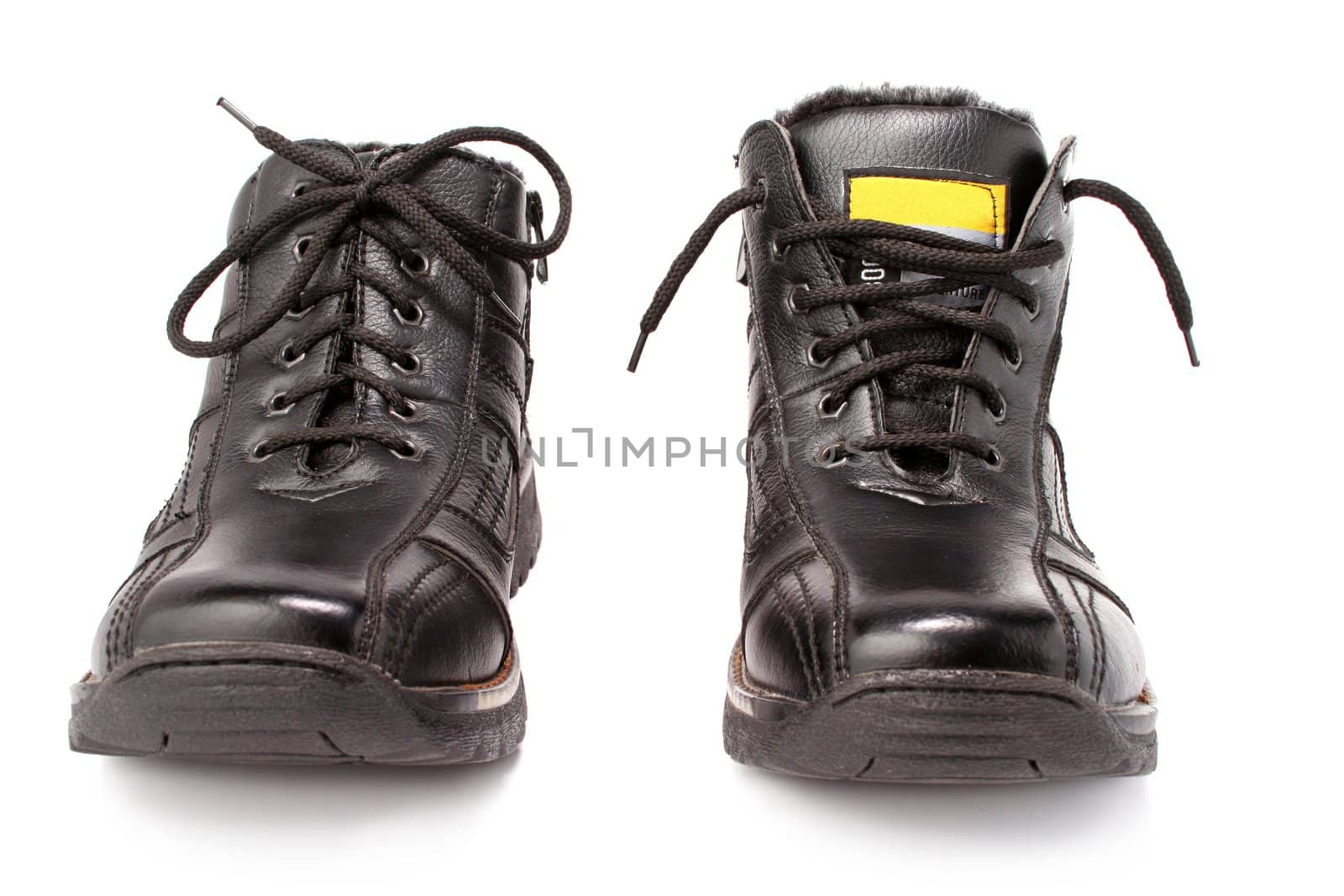Two man's winter leather boots of black color, isolated on white, (look similar images in my portfolio)