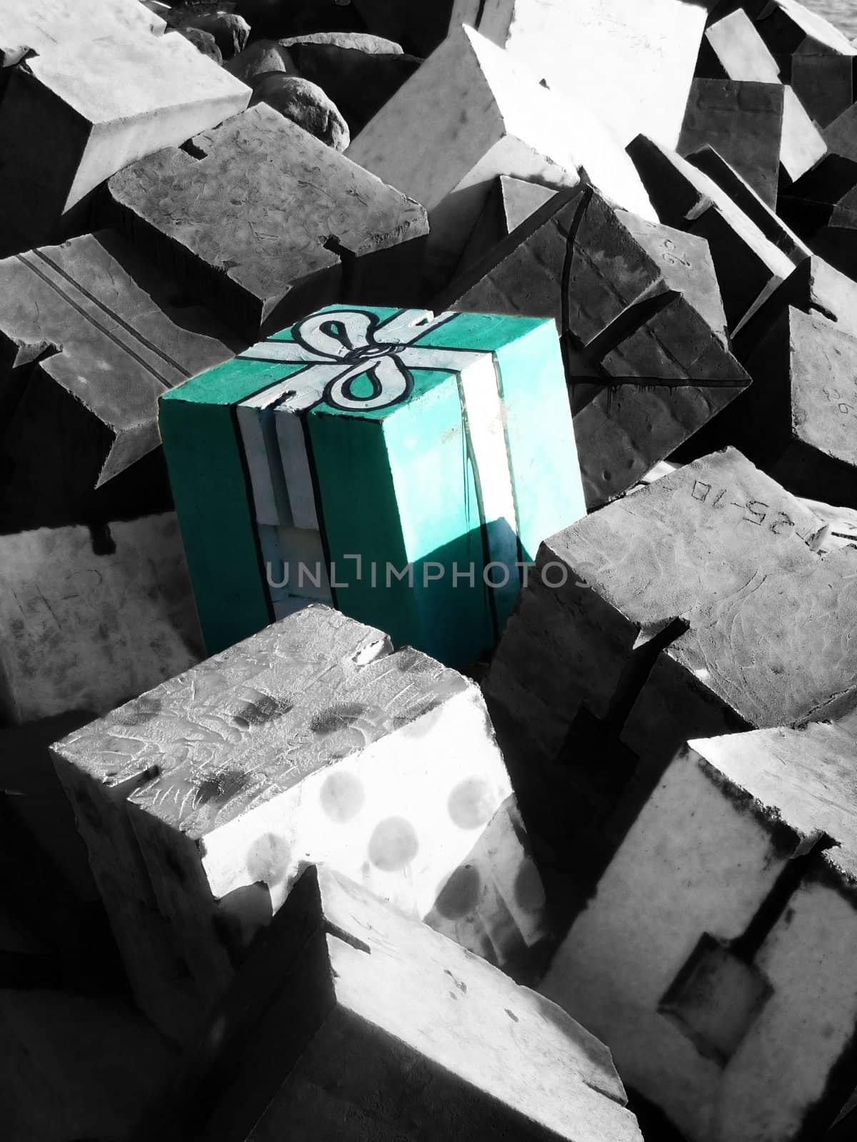 A cube of concrete that looks like a present.