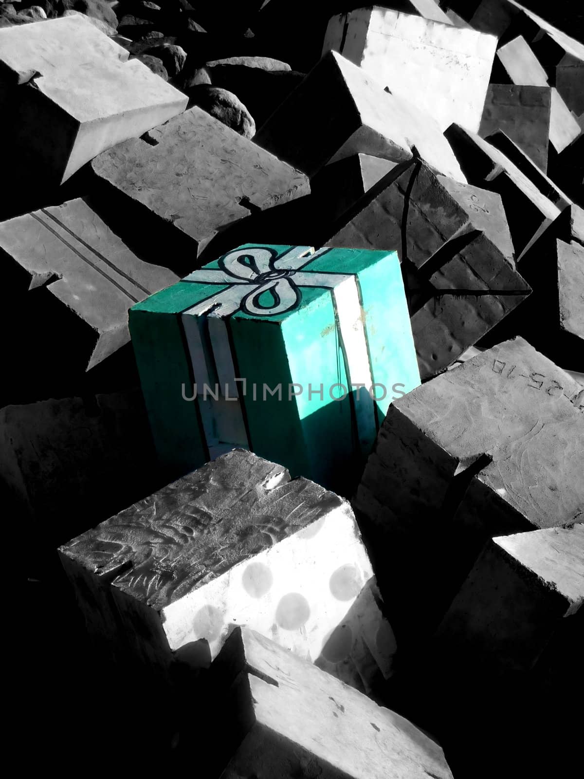 A cube of concrete that looks like a present.