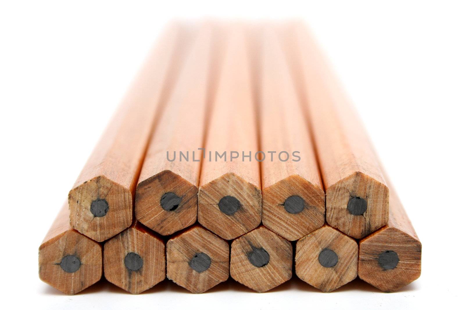 Pile of wooden pencils for plotting on a white background