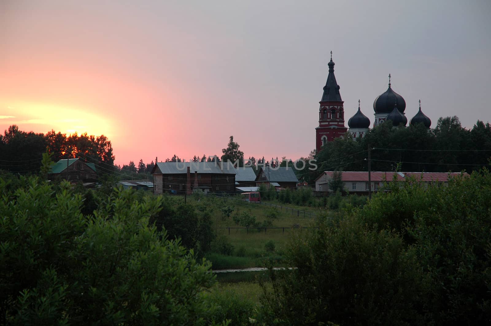 Female monastery against sunset. Russia