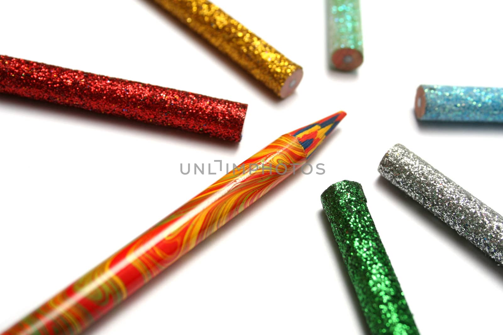 The multi-colour pencil is surrounded by brilliant pencils by parrus