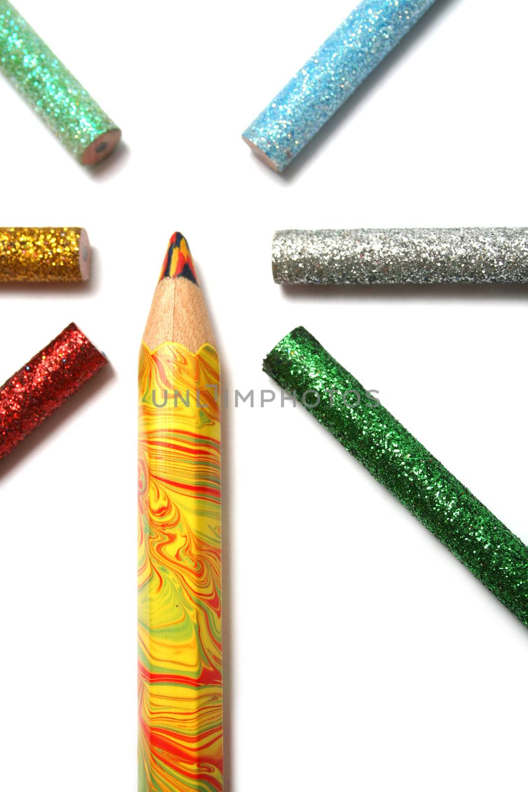 The multi-colour big pencil is surrounded by brilliant color pencils from above