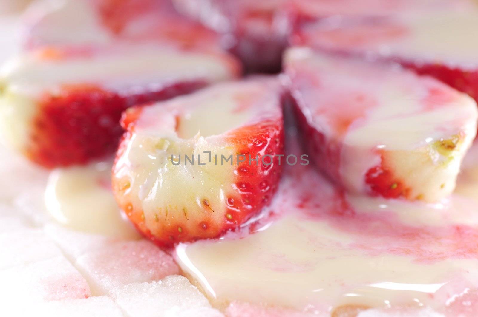 White sugar cubes background with strawberry and milk 2