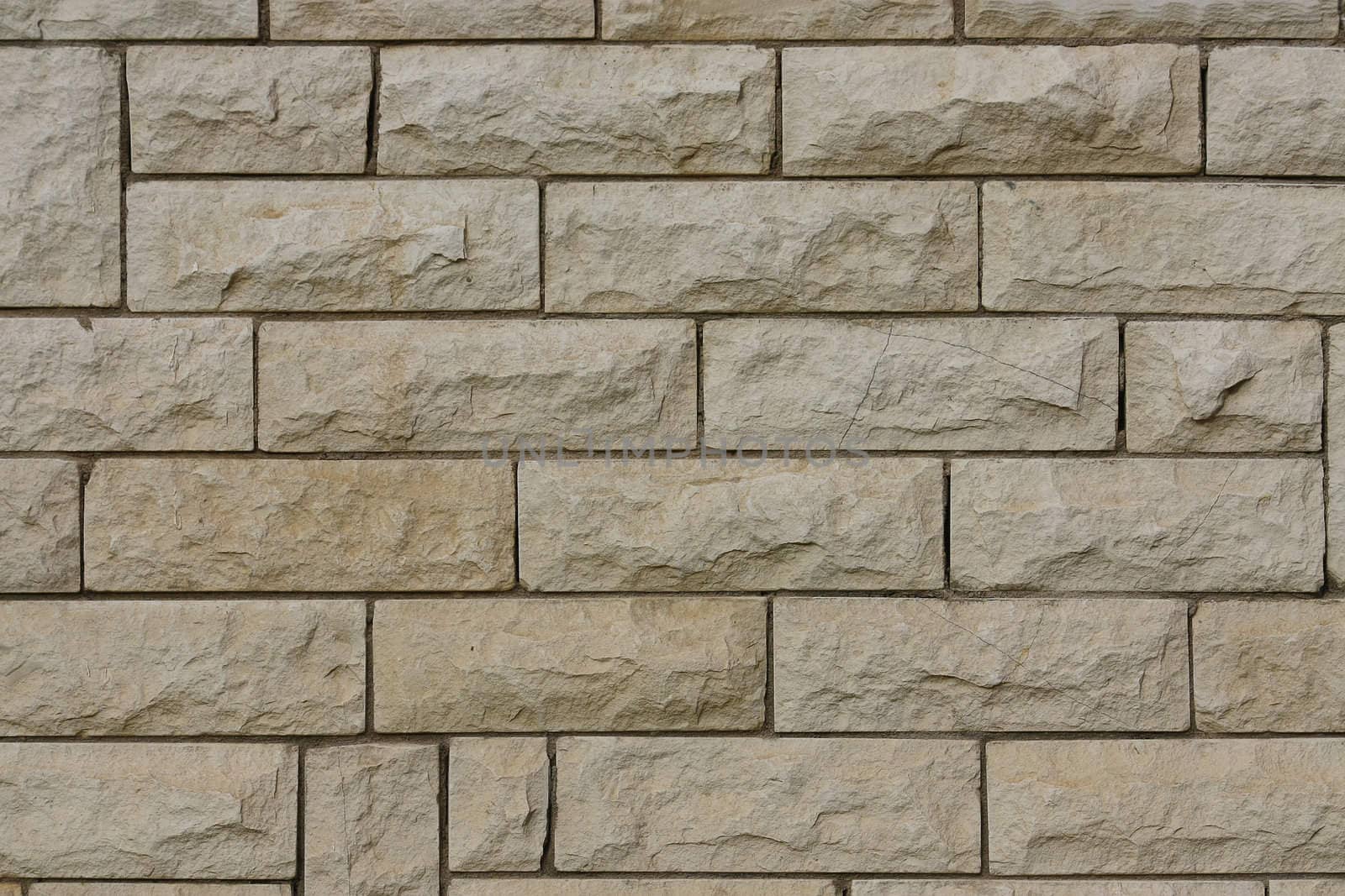 This interesting background represents the wall of a building combined from stones.