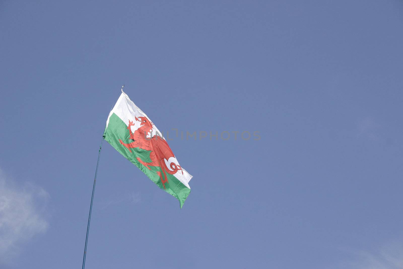welsh flag against a blue sky