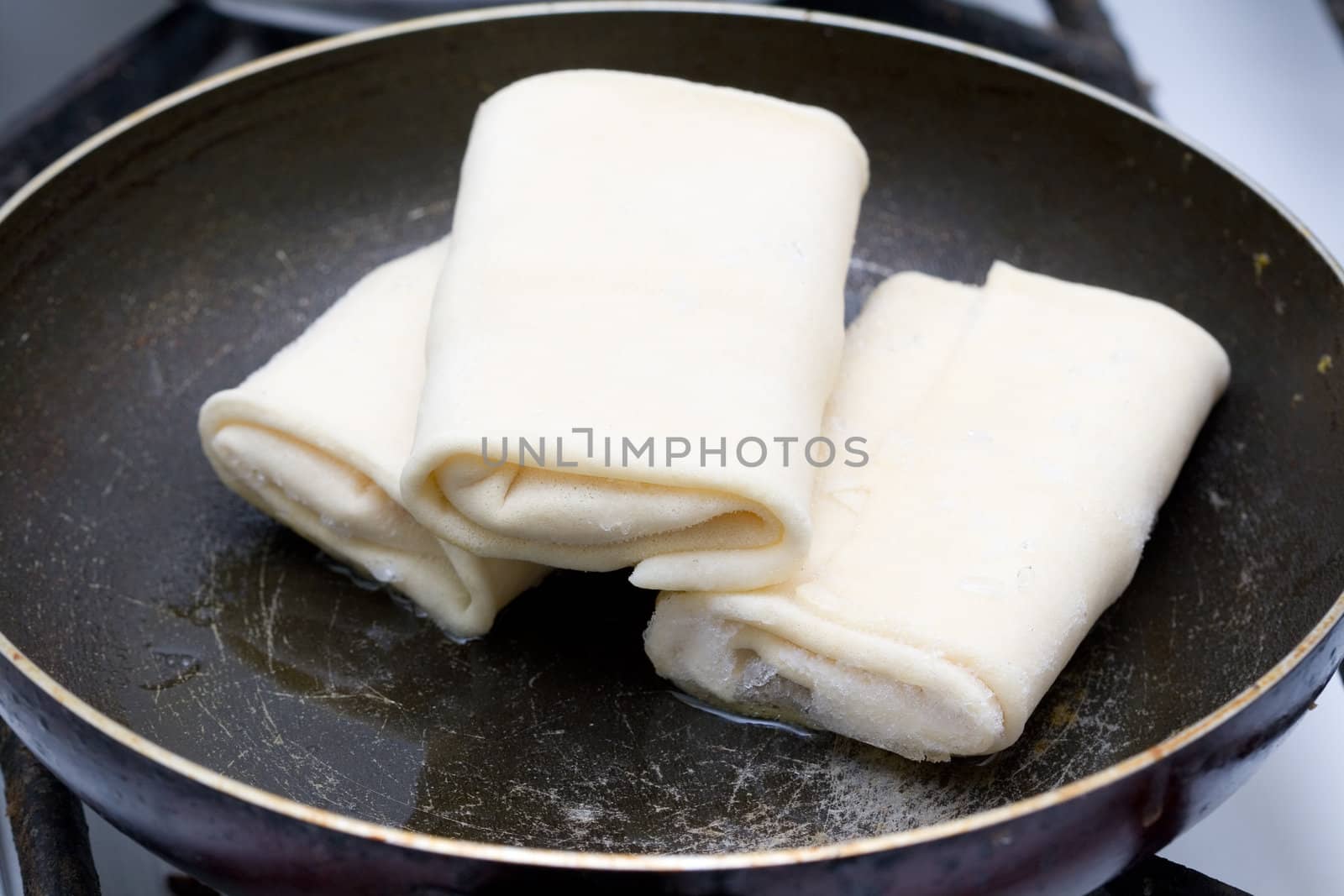 cooking pancakes in the old frying pan