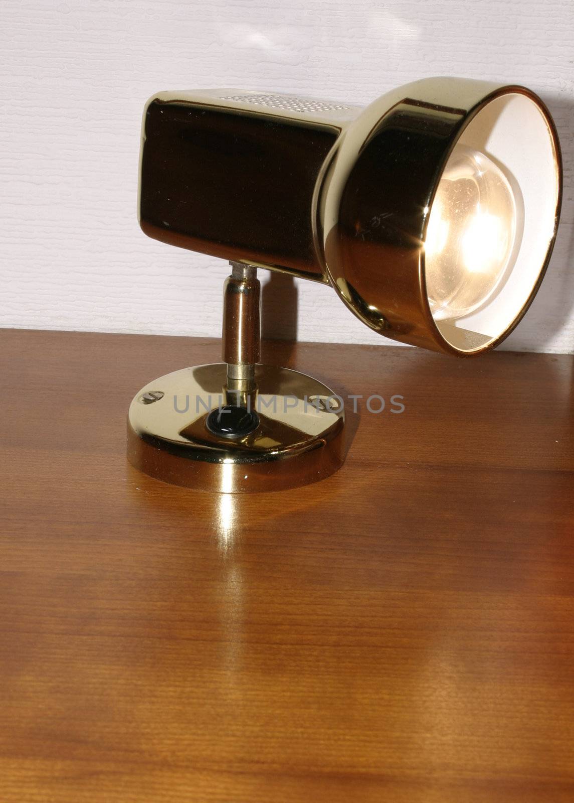 bedside lamp with the bulb lit