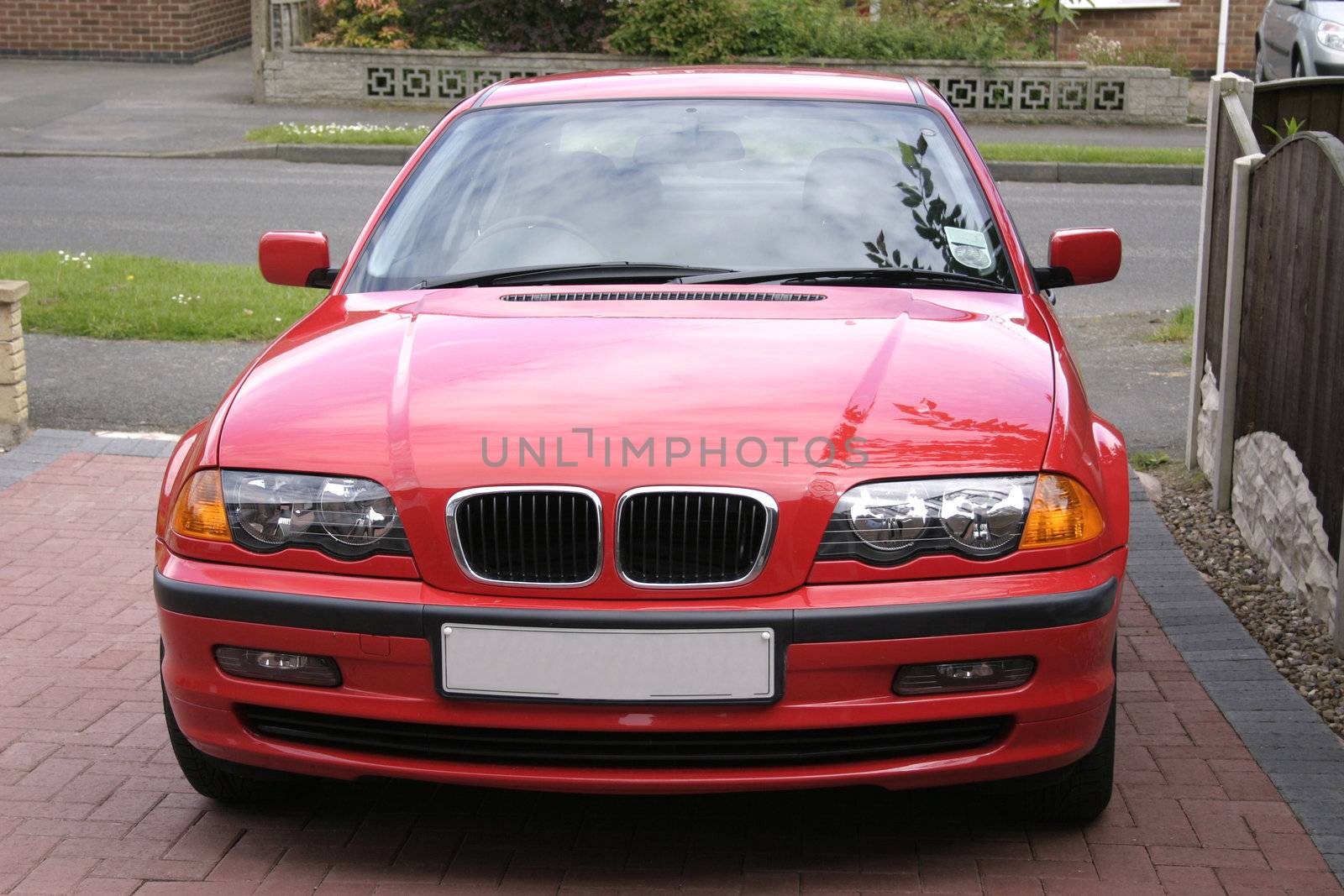 red bmw taken from a front view