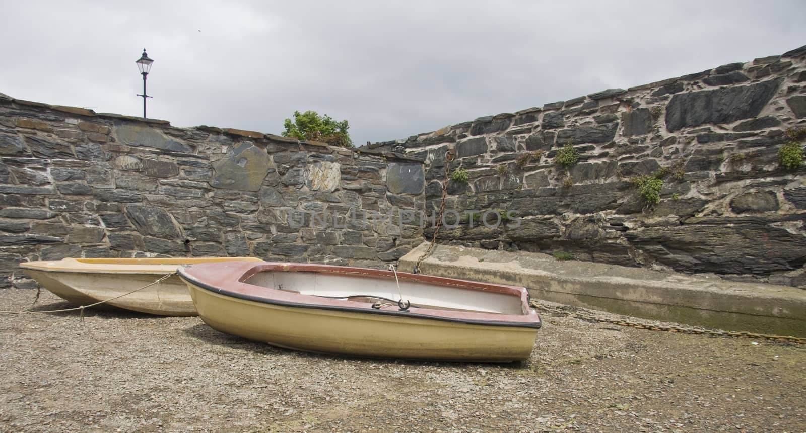 Two rowing boats high and dy.