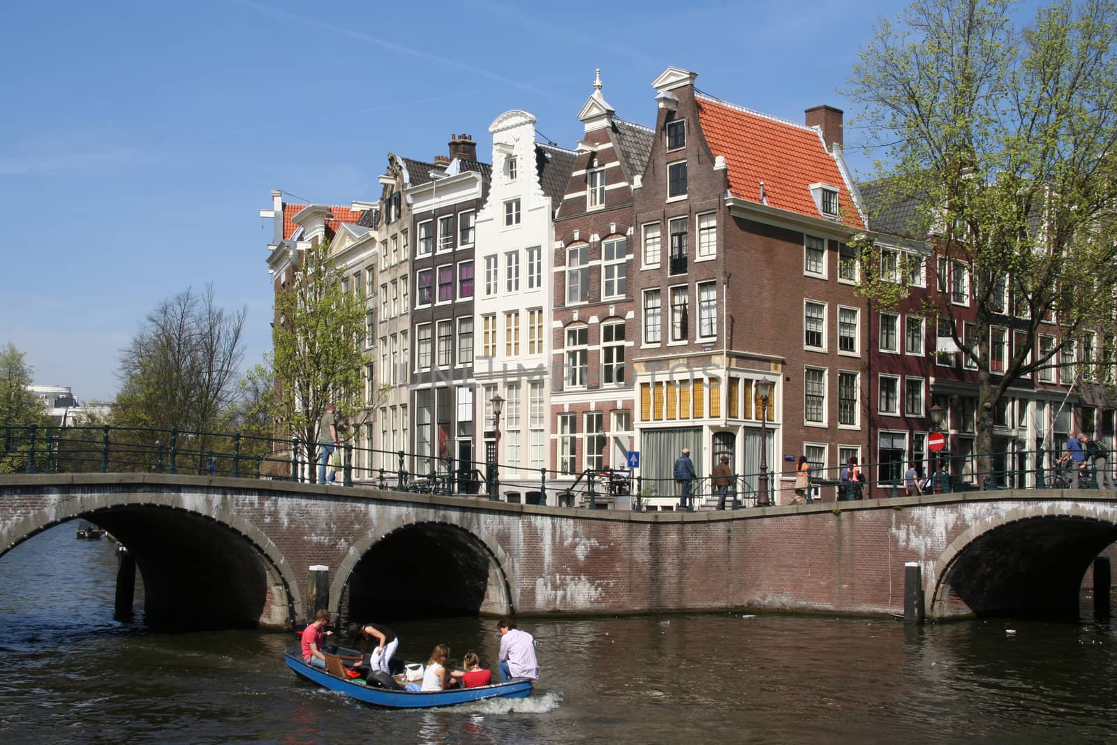 People boating in an Amsterdam canal