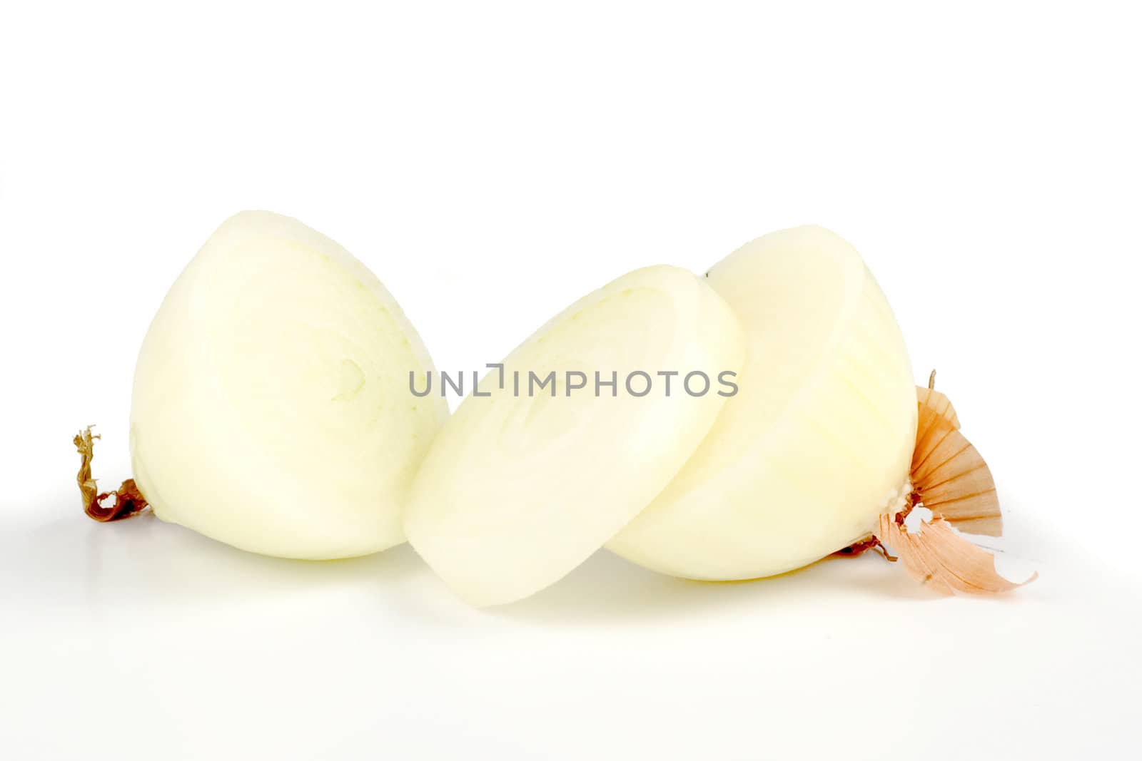 an onion cut in slices, on a white background