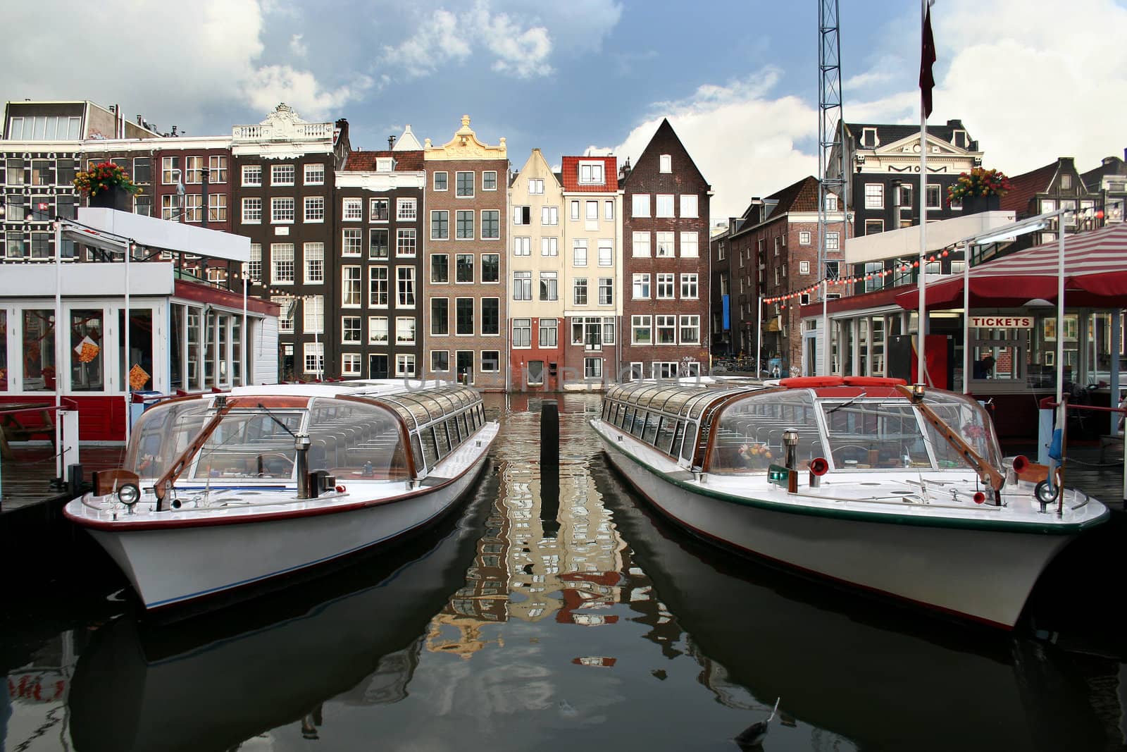 Tour boats and ticket office in Amsterdam canal